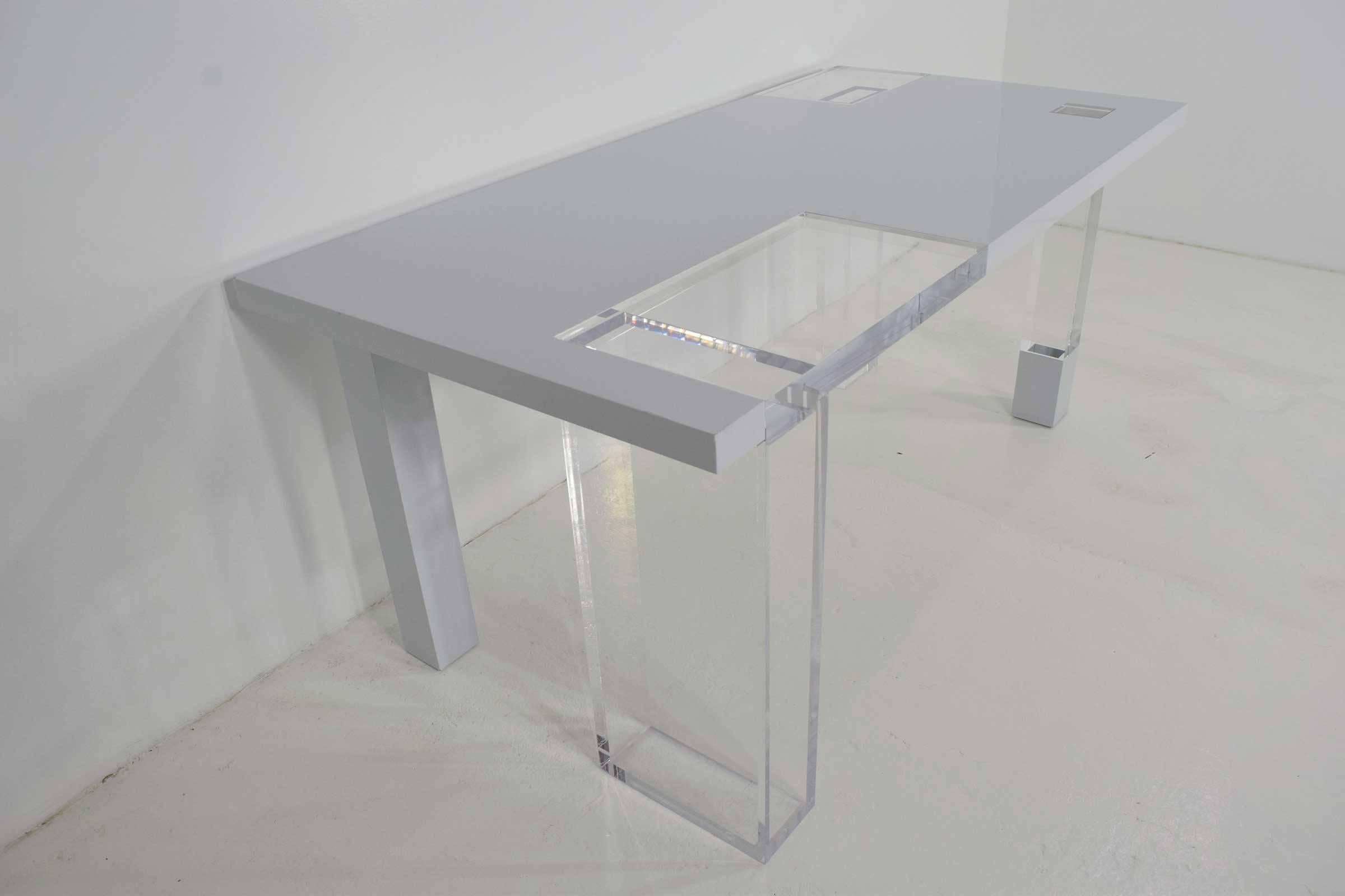 A beautiful Lucite and white lacquer table. Ideal for a work table, entry table or display table. Can also be used as a desk or dining table but check height. This table was likely a custom piece and is signed by the designer/maker. It is very heavy