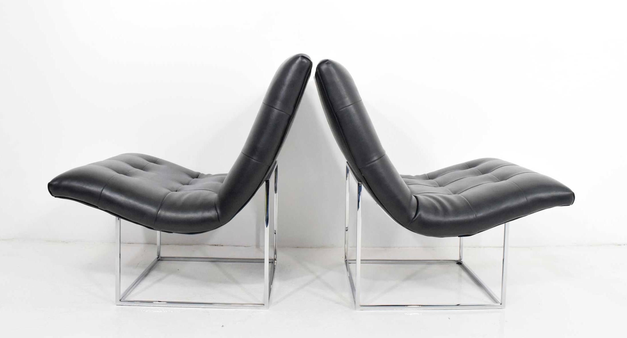 Pair of Milo Baughman lounge chairs in tufted faux leather and chrome bases.