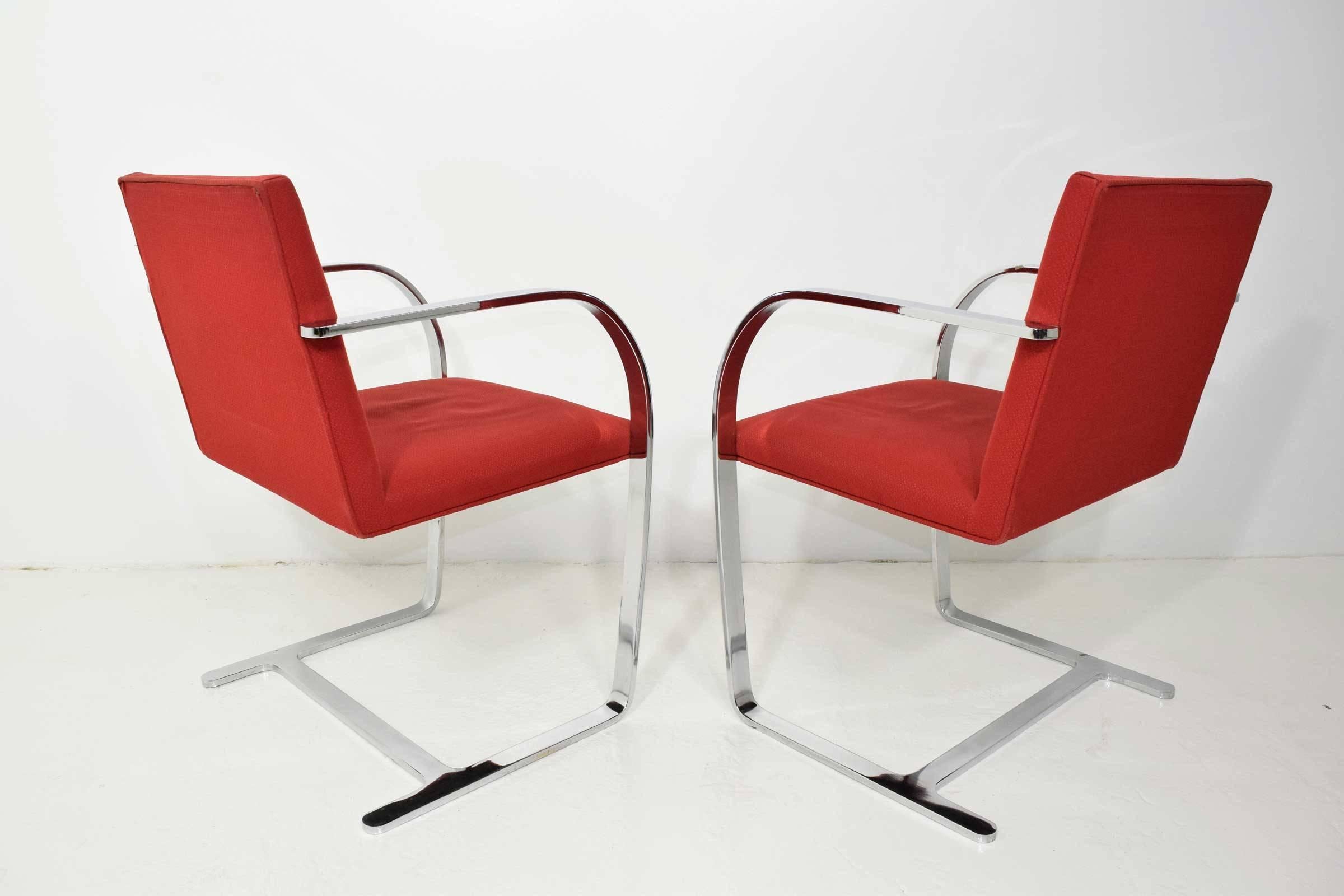 Pair of Brno chairs with steel frames and red upholstery. By Gordon International.