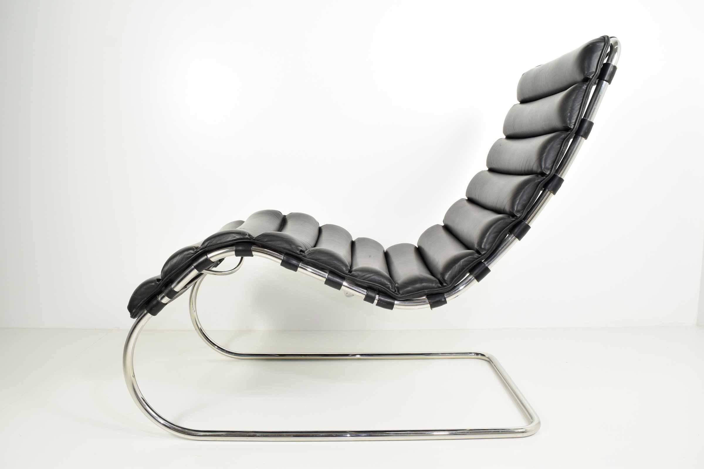 Tubular frame, black leather. Very comfortable. Designed by Mies van der Rohe in 1927.