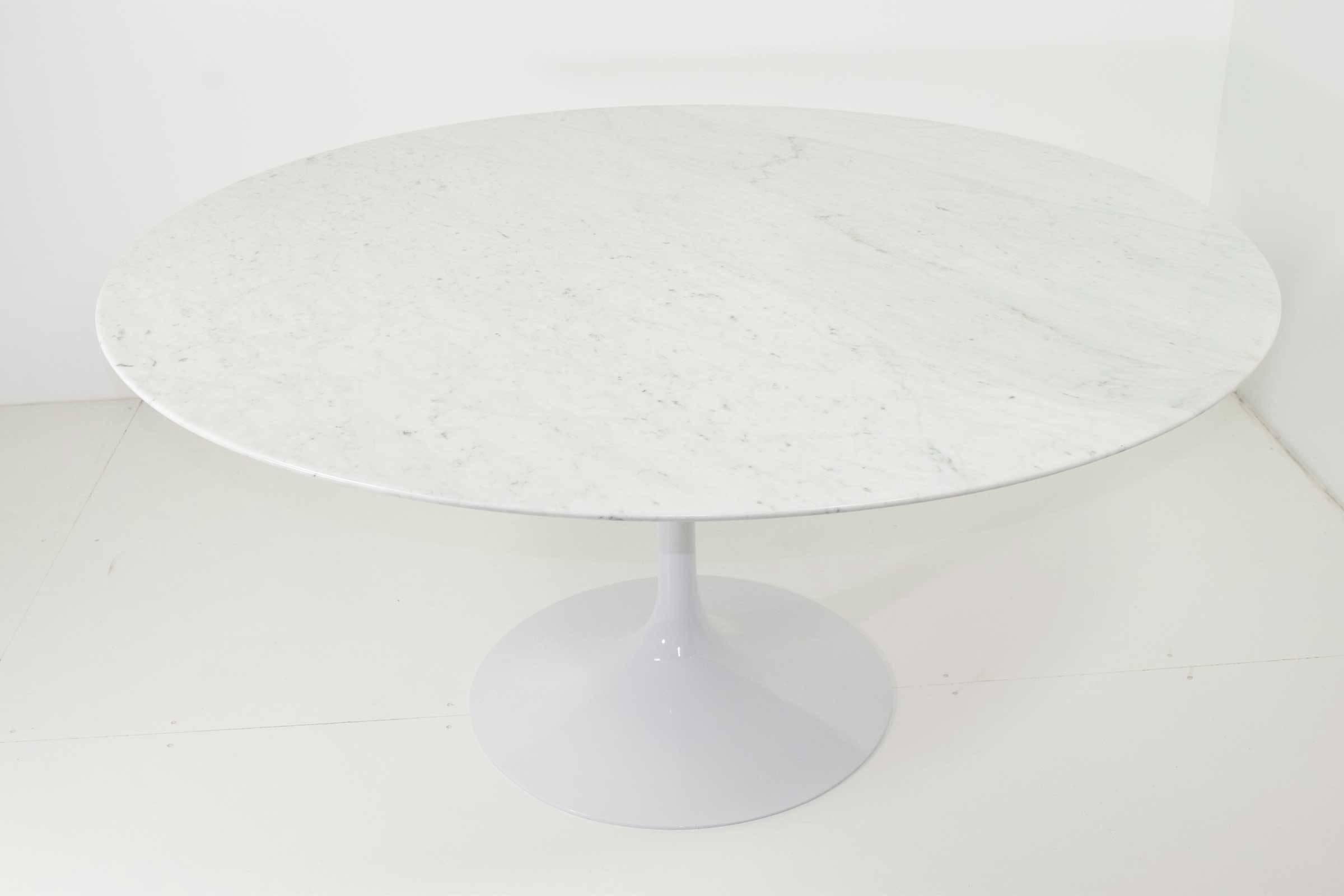 This is an early Knoll iron base. The base has been restored with a shiny finish. The marble is new and polished Carrara. Measures: 60