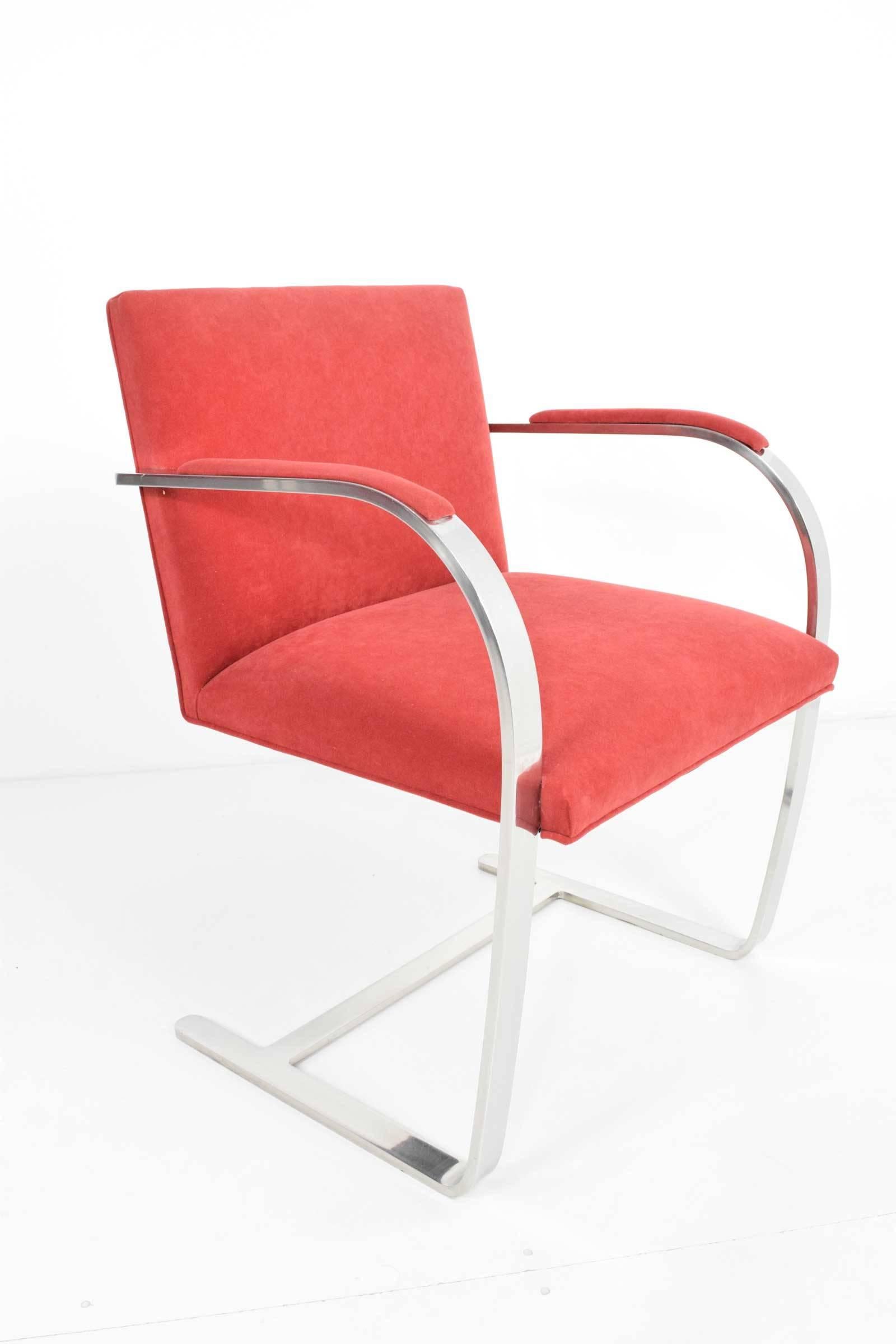 Set of six flat bar Brno chairs by Mies van der Rohe for Knoll. Chairs have a red suede type fabric which is on nice condition. Chairs have arm pads. Stainless steel frames in nice condition but with some scratches and scuffs from use. These can be