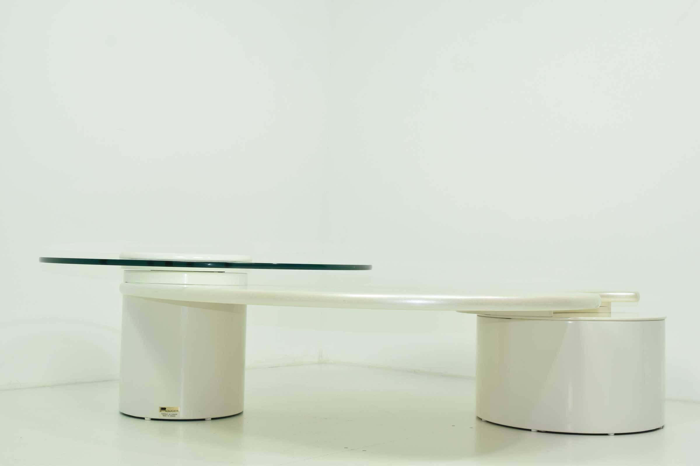 Coffee table is in white lacquer, with pearlized lacquer on centre section. Glass top section is movable and can be pulled out to extend. Table is very beautiful and unique. In great condition as well.