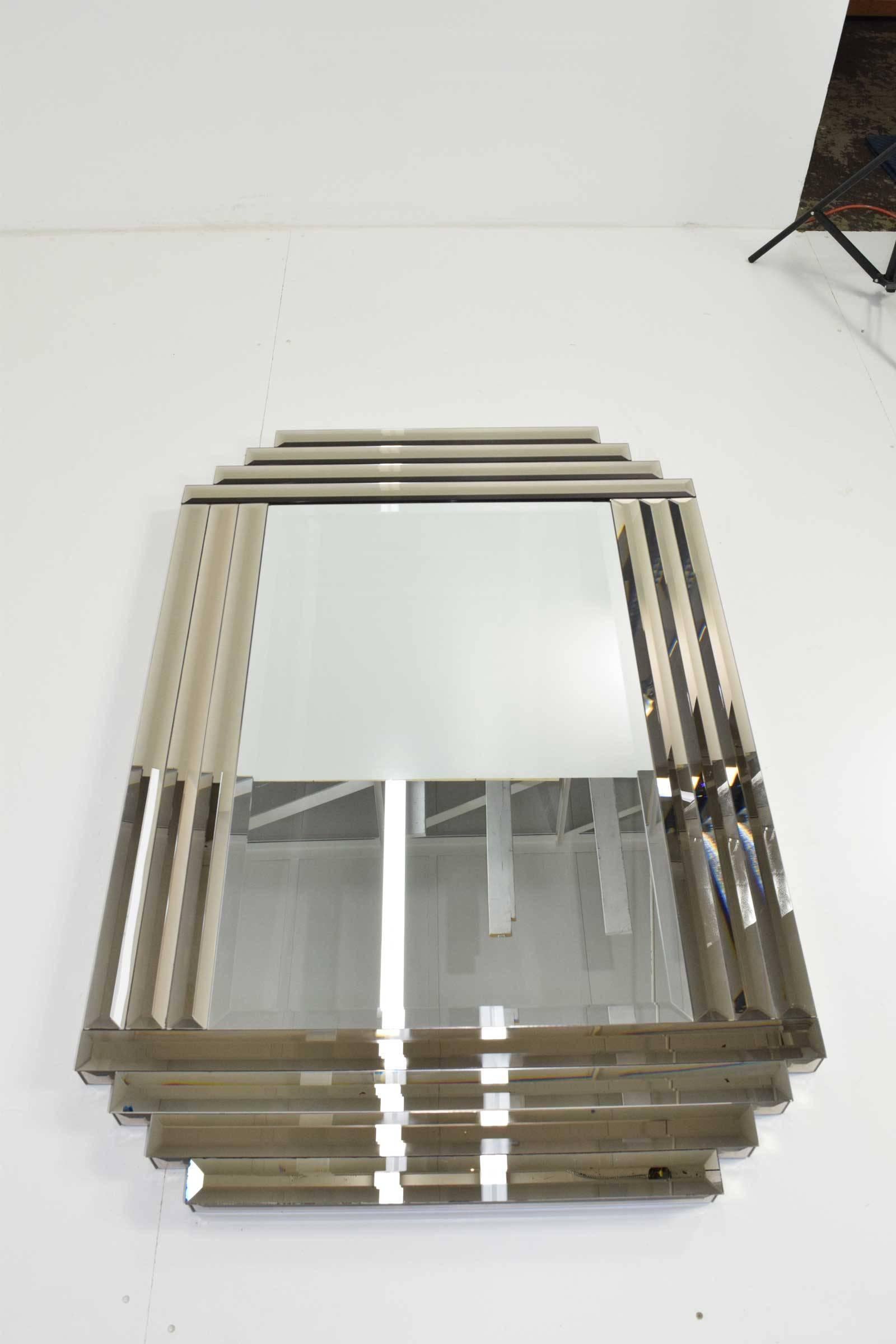 Bronze three layer beveled mirror edges. Beautiful mirror that can be hung horizontal or vertical. Perfect for any decor. This mirror is very well made with a heavy wood backing.