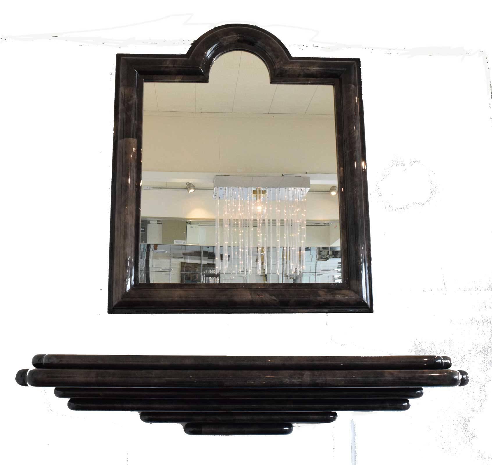 This is a stunning console and mirror in the style of Karl Springer. In goatskin with browns, blacks, beige coloration. Console is 6 stacked layers of various sizes with softly rounded edges. Console is 60