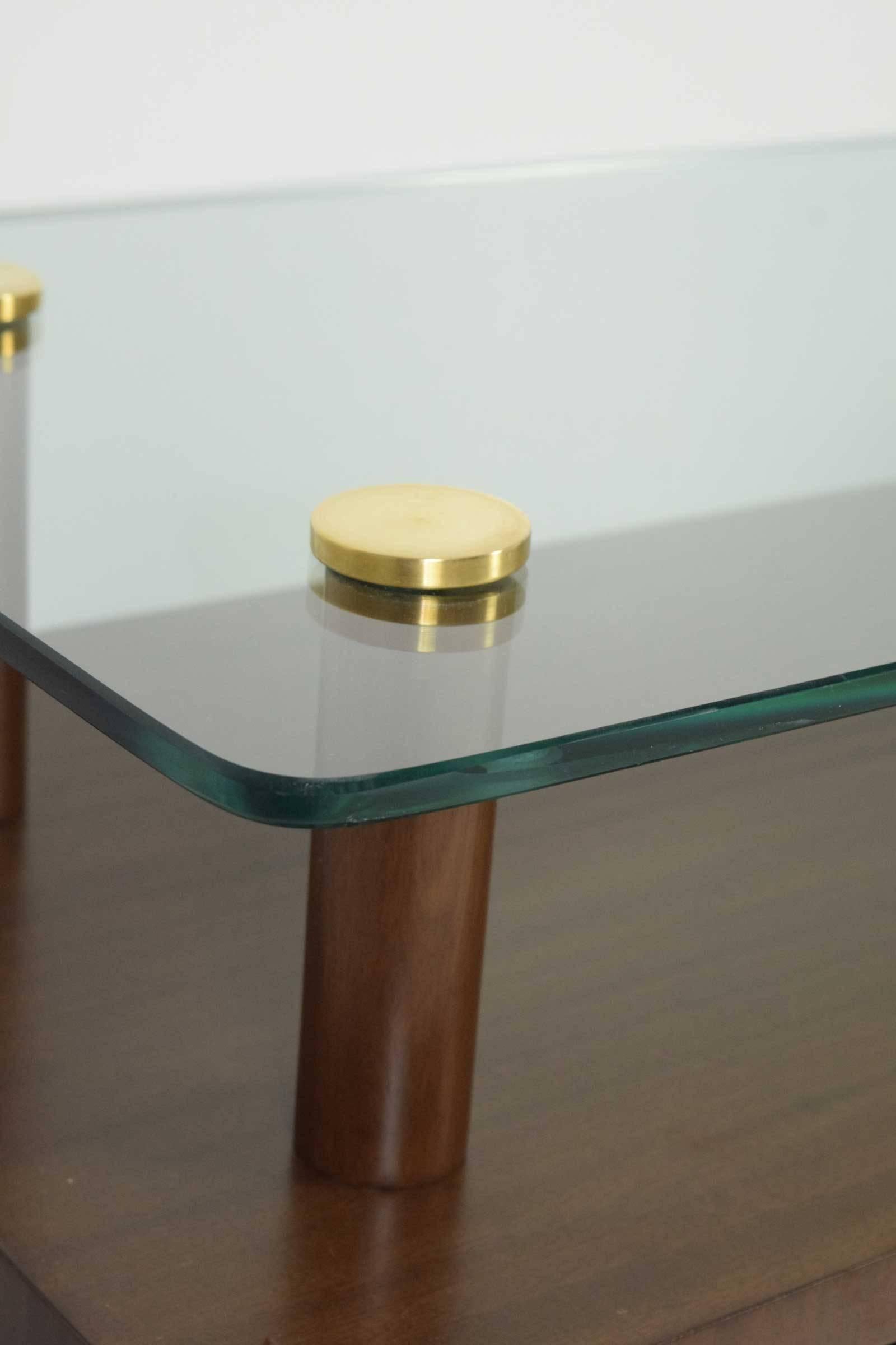 Restored nightstands with glass tops and single door compartment. Brass detail. Gilbert Rohde for Herman Miller.