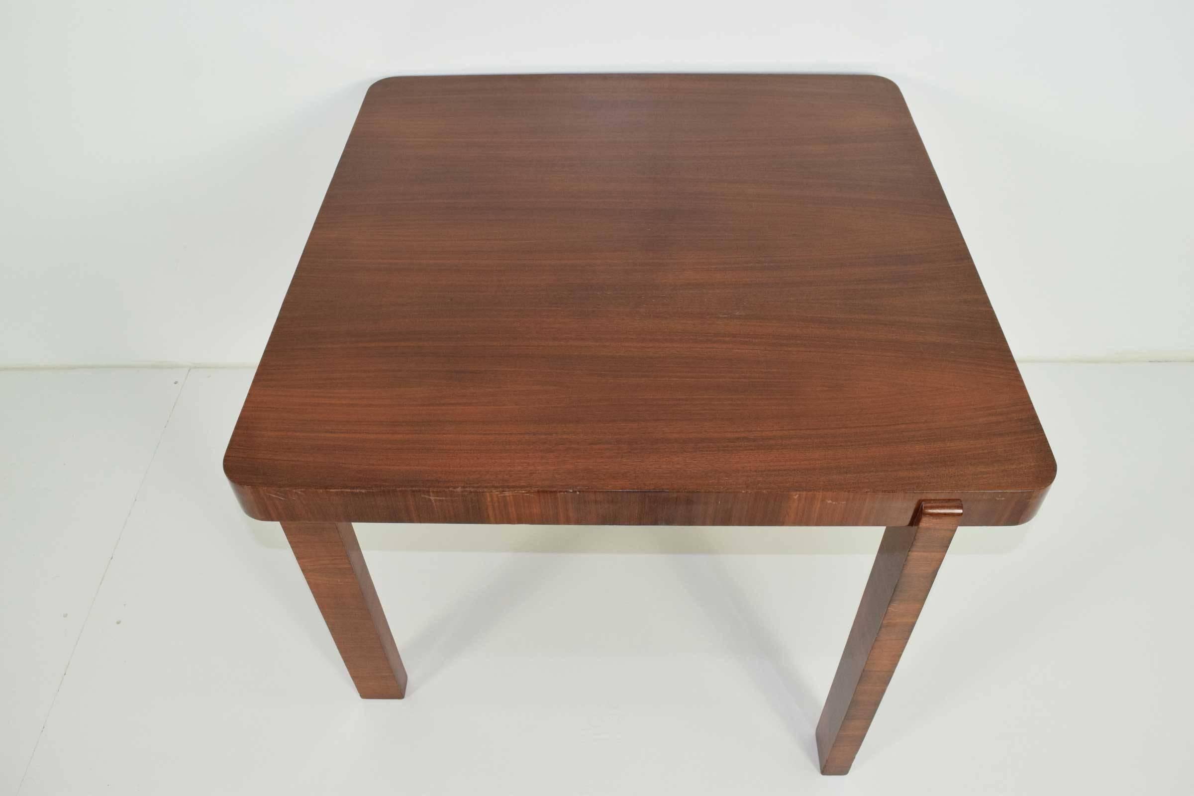 Unique style card table in a mahogany finish.