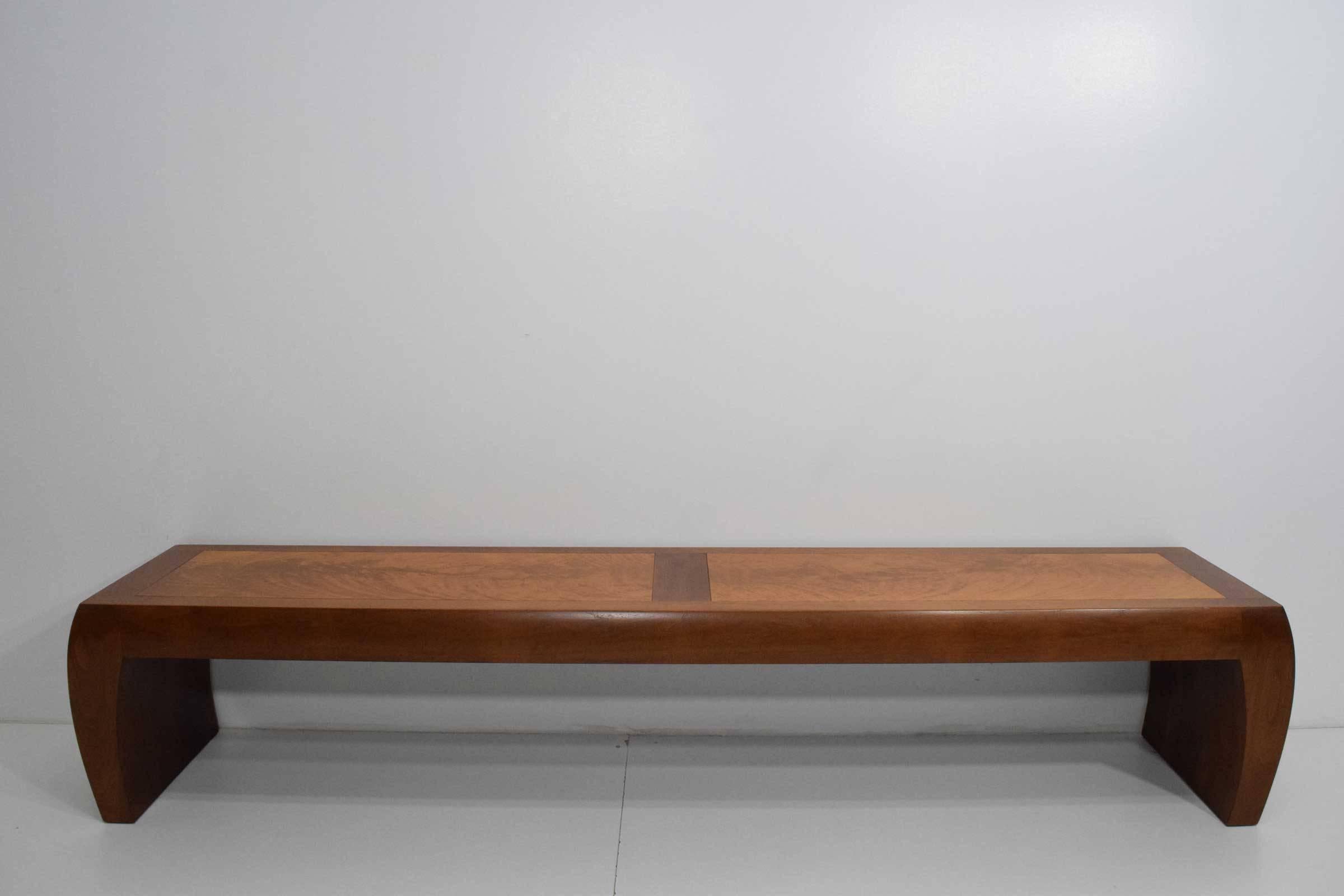Long bench by Christian Liaigre for Holly Hunt. Stamped on underside. Beautiful bookmatched exotic wood pattern  on top, slightly curved legs. 