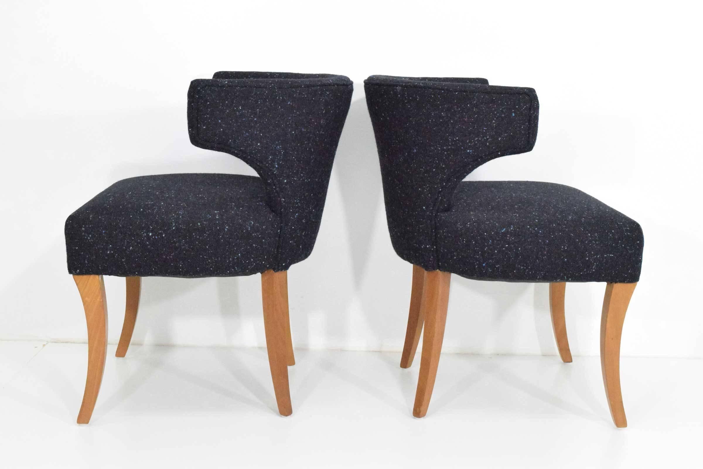 A pair of Dunbar lounge chairs by Edward Wormley. Upholstered in a textured wool.