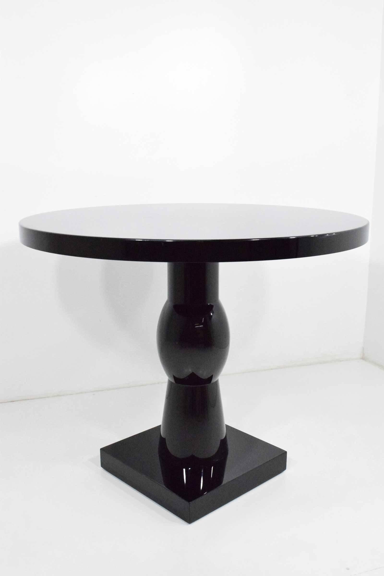In high-gloss black, the Scarab table by Christian Liaigre.