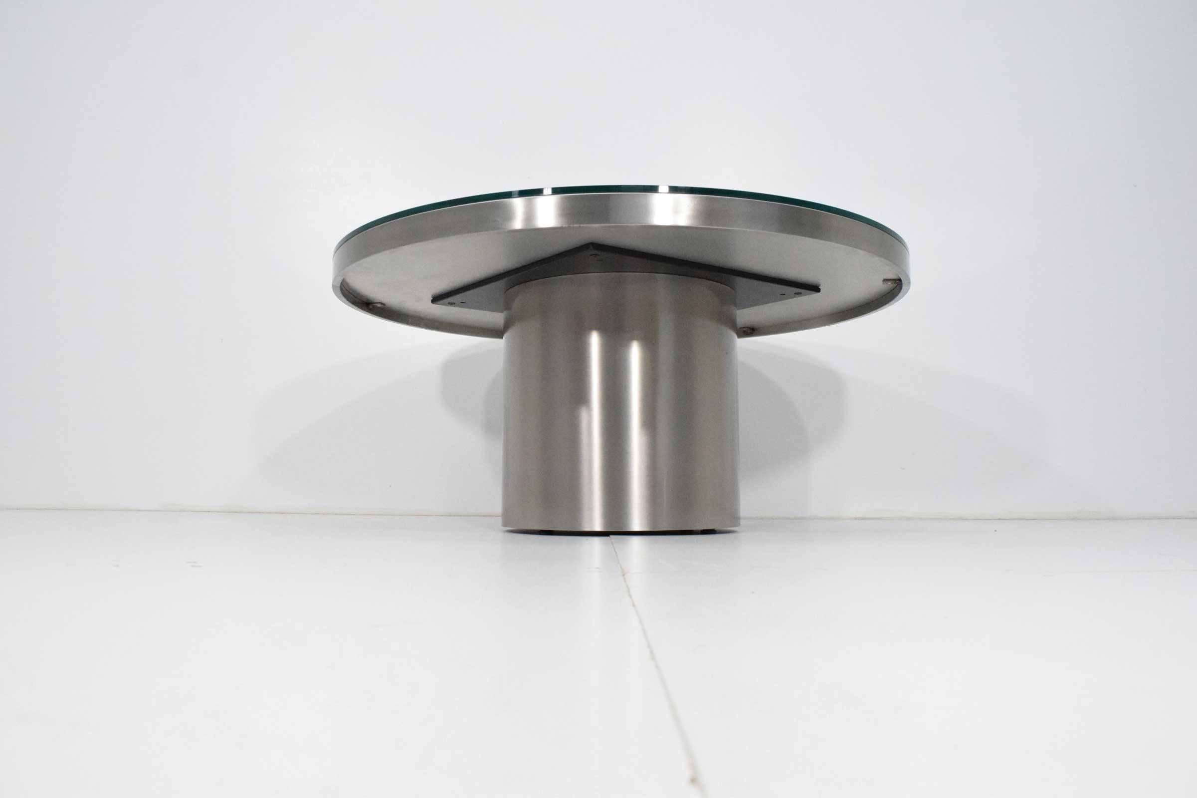 This is very much of the quality of Brueton. Polished stainless steel base with glass top. In beautiful condition.