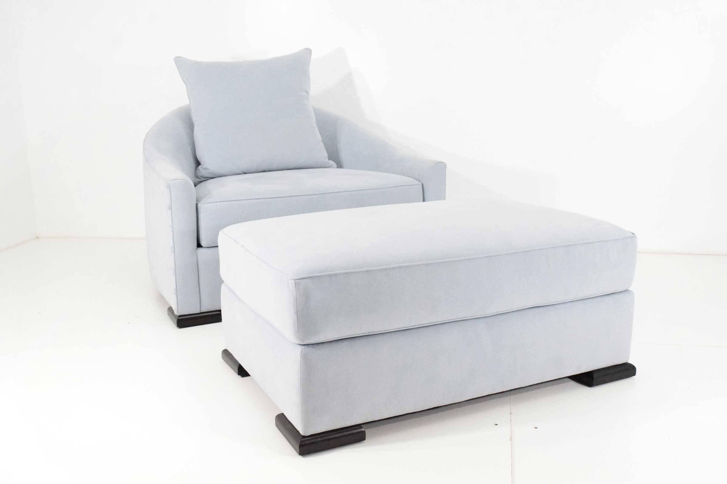 A pair of beautiful Mattiliano Dupre Lafron lounge chairs with matching ottomans done in a pale blue suede. Ottomans are 36