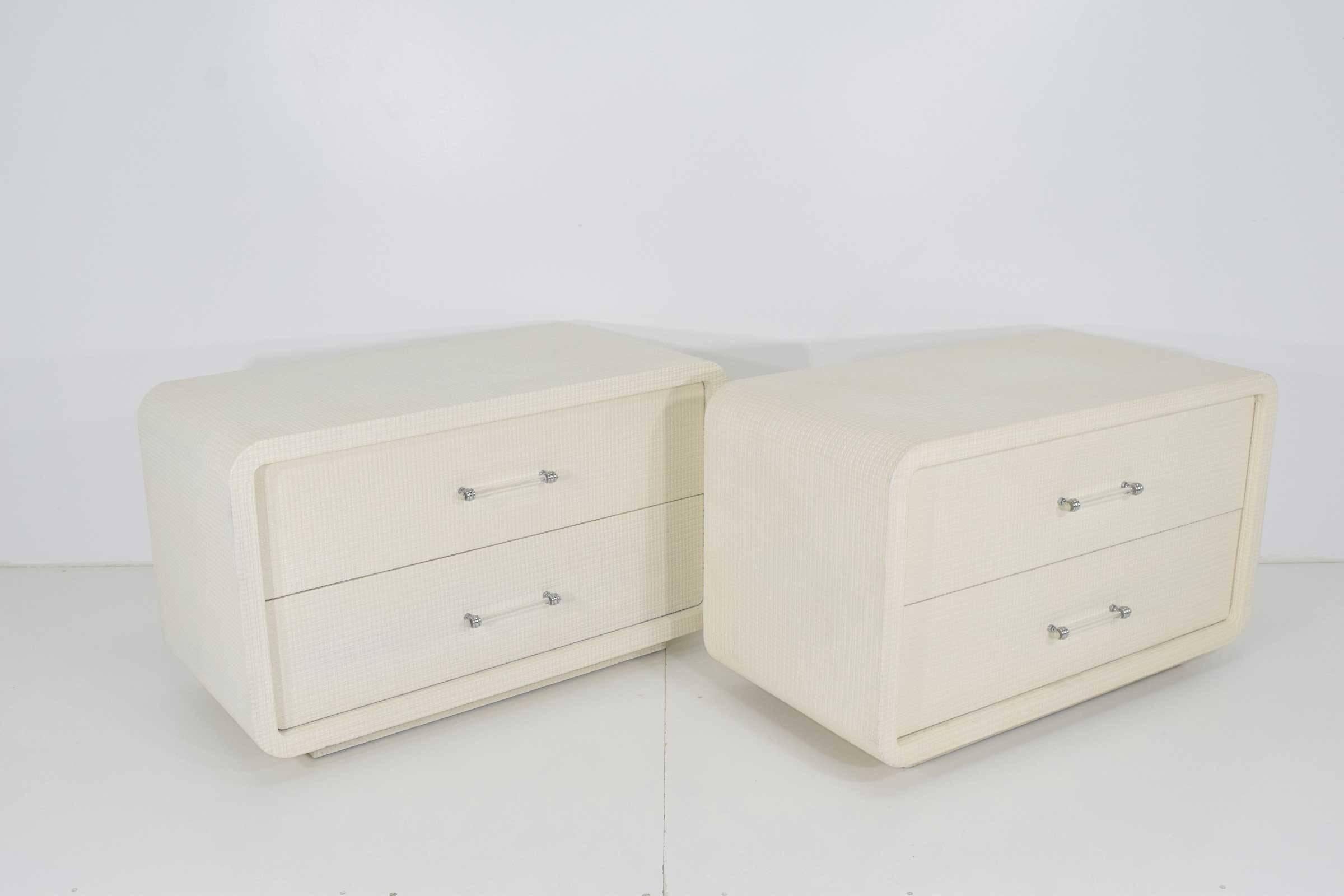 Nightstands are very well-made, rounded edges, lacquered grasscloth, Lucite handles. Each chest has two drawers.