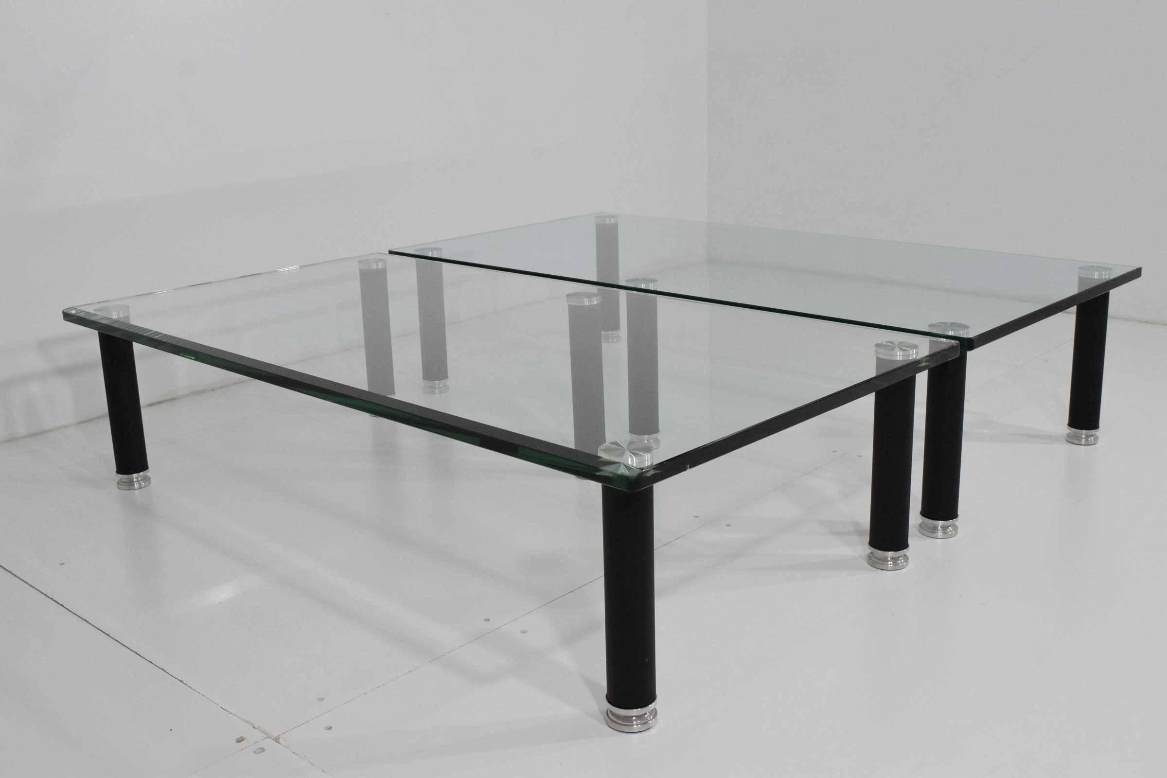 A pair of coordinating coffee or cocktail tables by Leon Rosen for Pace. Tables can be butted up next to each other or they can be separated by a few inches. Three sides of each are beveled and each has five legs. Measure: Each is 48