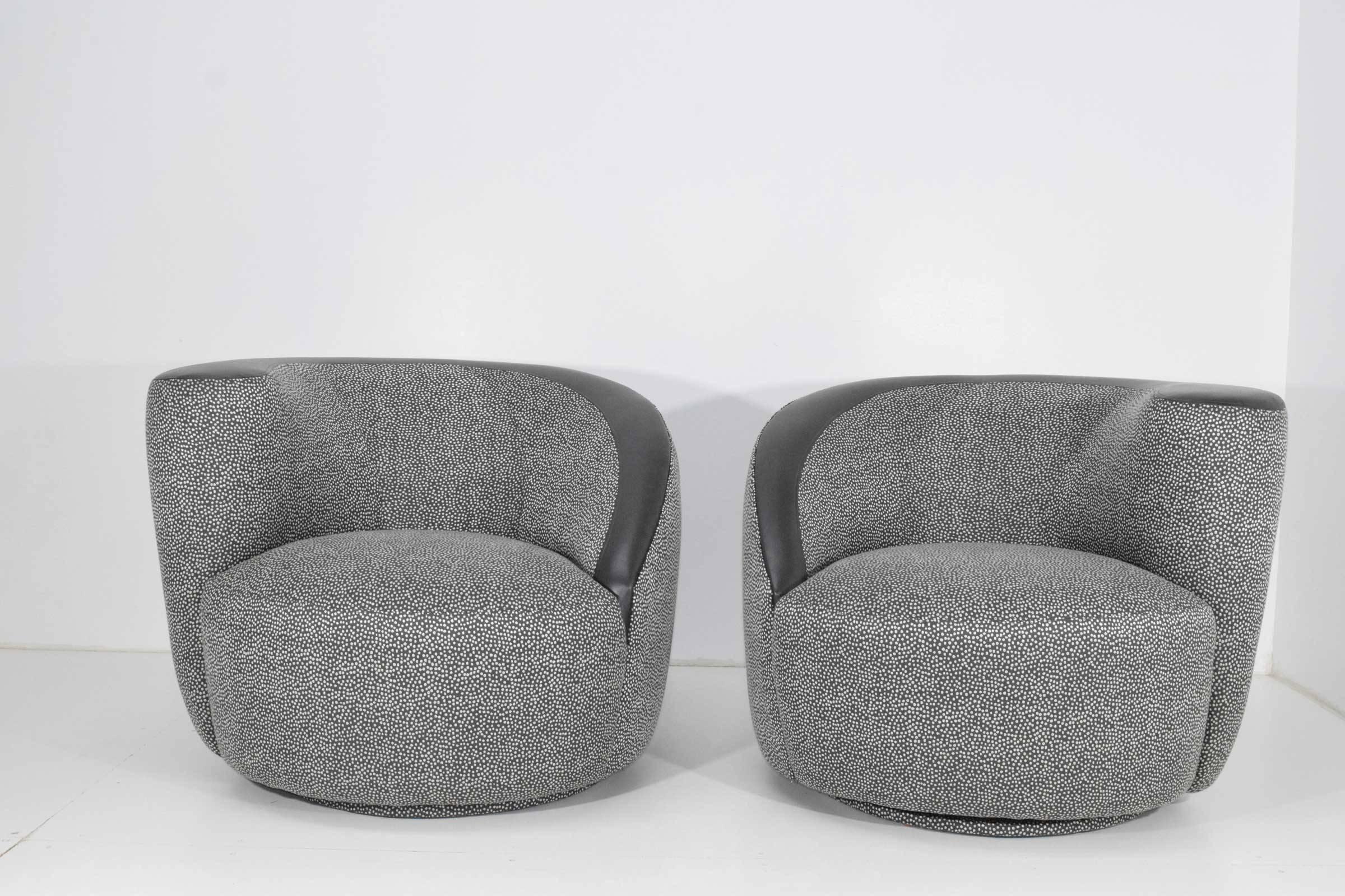Vladimir Kagan meets Kelly Wearstler. Newly upholstered nautilus chairs in Duralee fabric with faux leather trim.