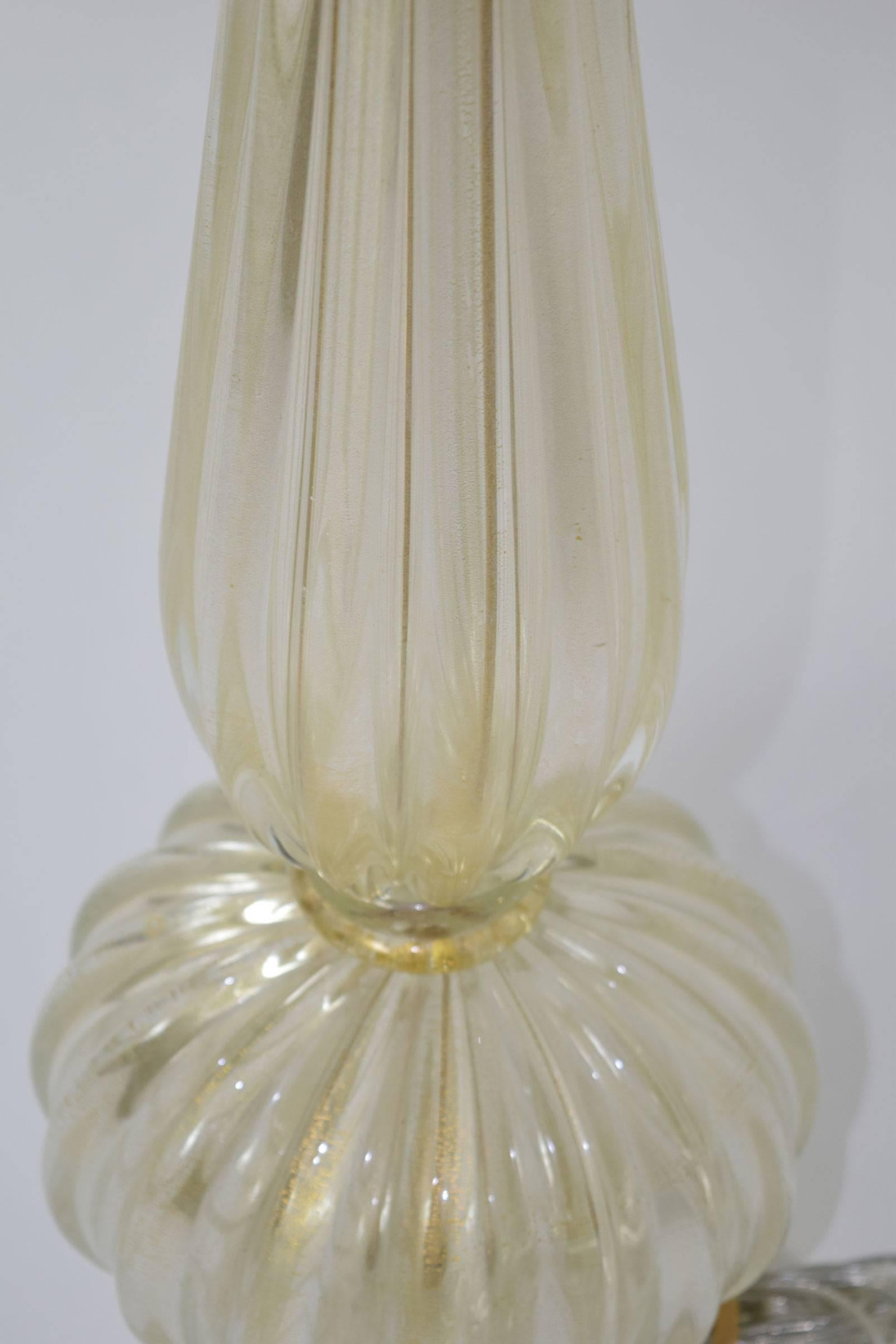 Footed Murano table lamp with gold flecks throughout.