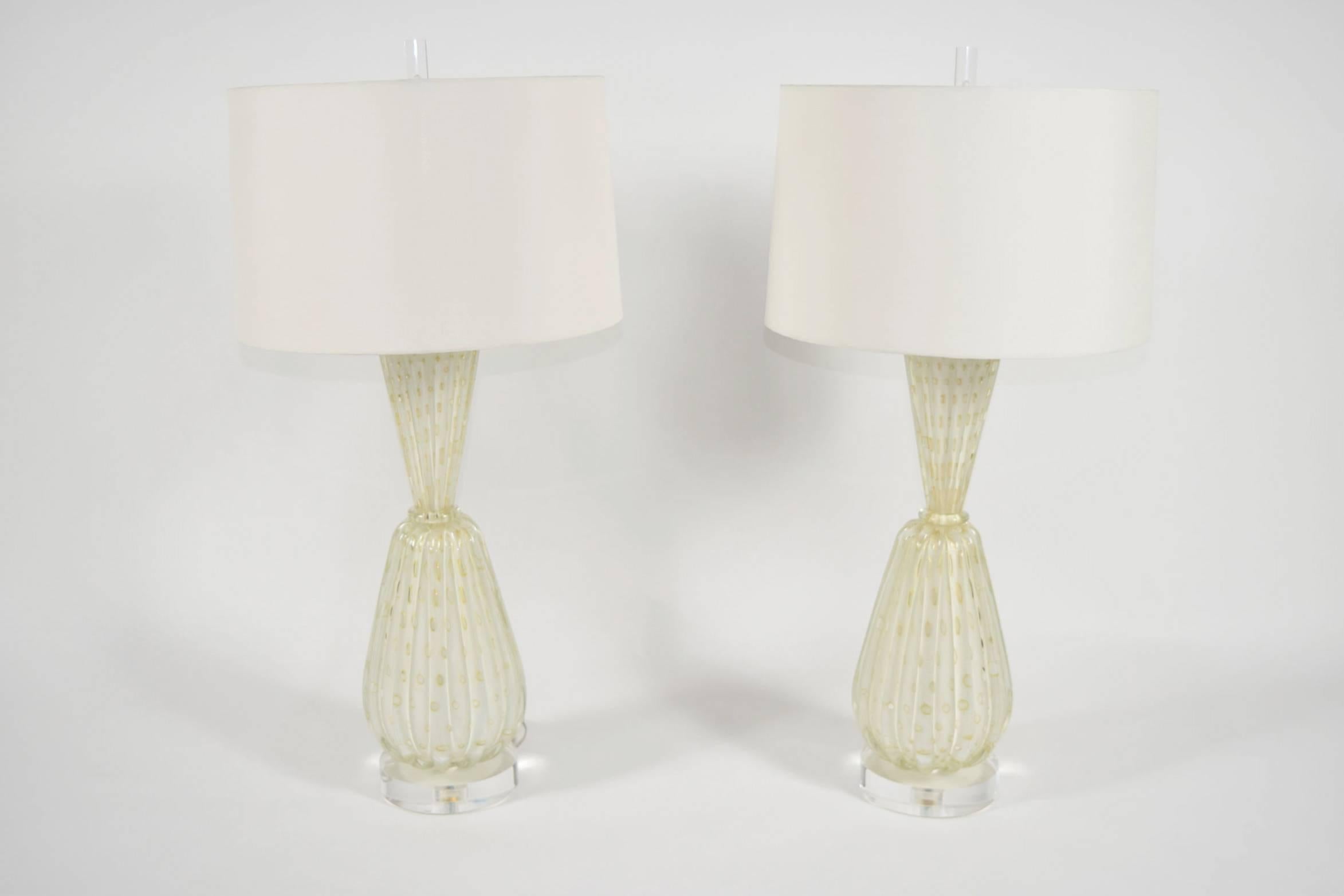 Beautiful pair of large Barovier & Toso Murano lamps. Glass is clear with gold flecking. Lamps have been restored with lucite bases and finials added. Newly rewired. 