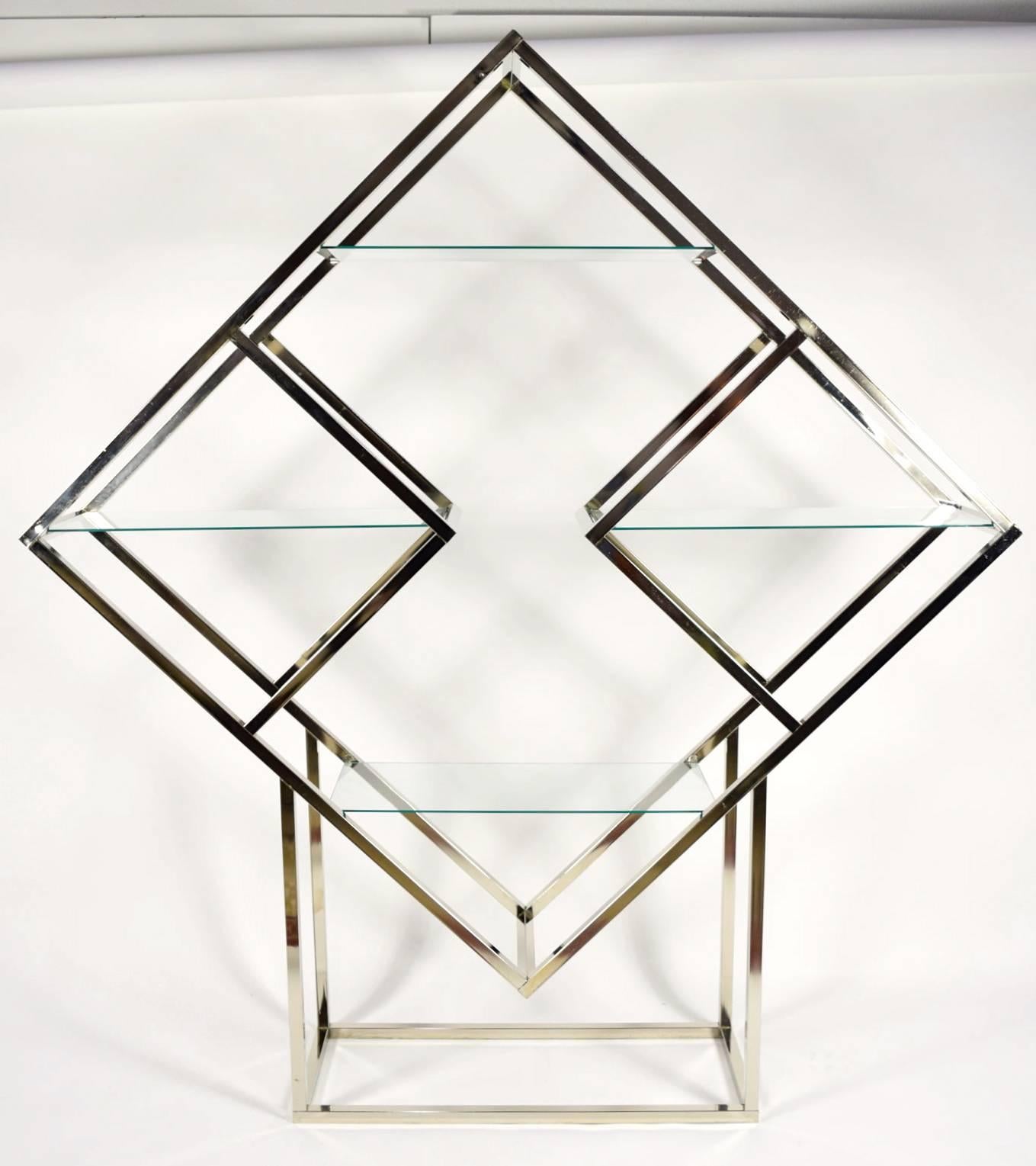 Polished with a silver finish and glass display etagere attribute Milo Baughman and in the style of Romeo Rega.