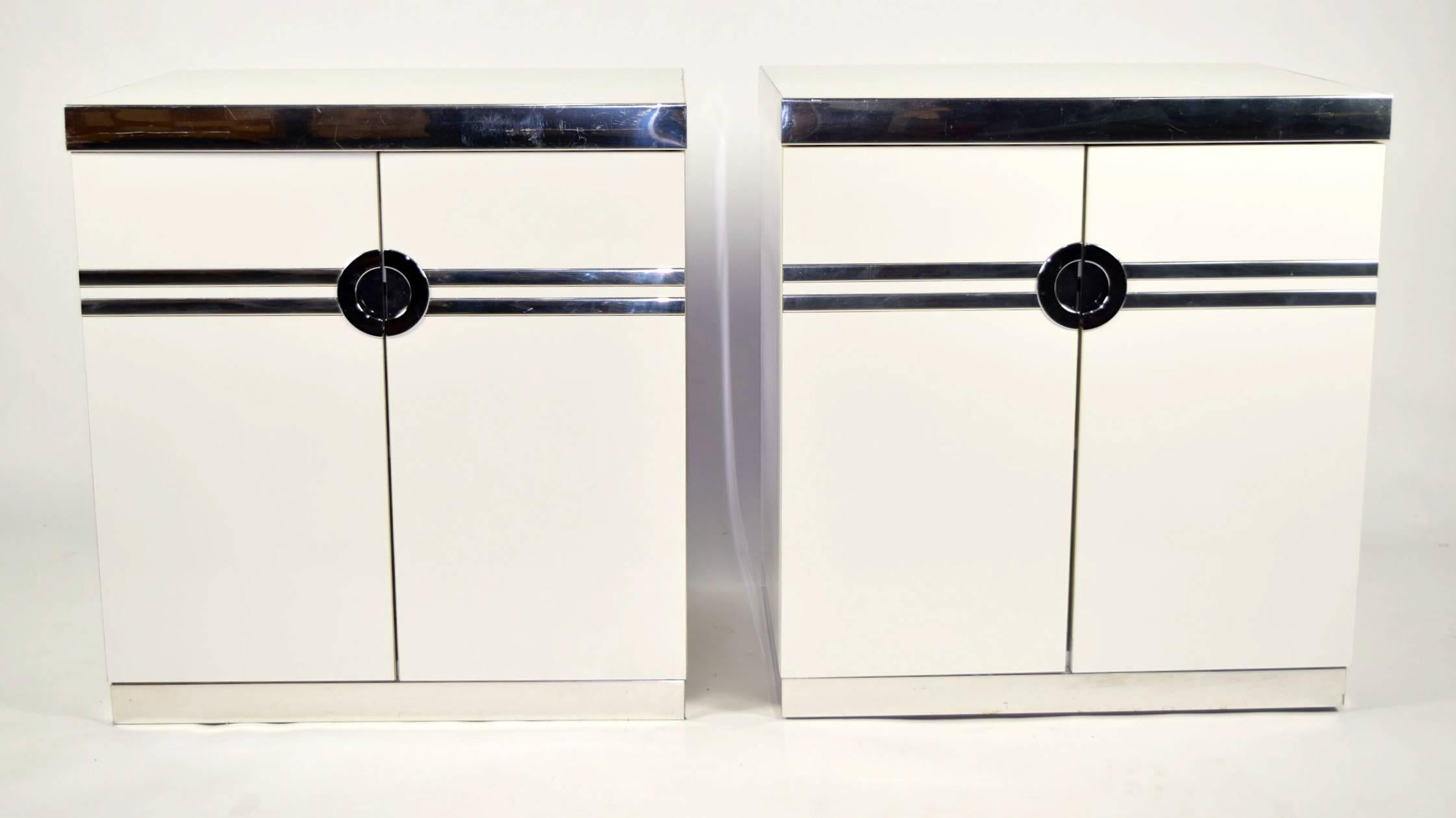 Pair of Pierre Cardin night stands in glossy white laminate with chrome trim. Pieces are signed. Please see our matching dresser. 