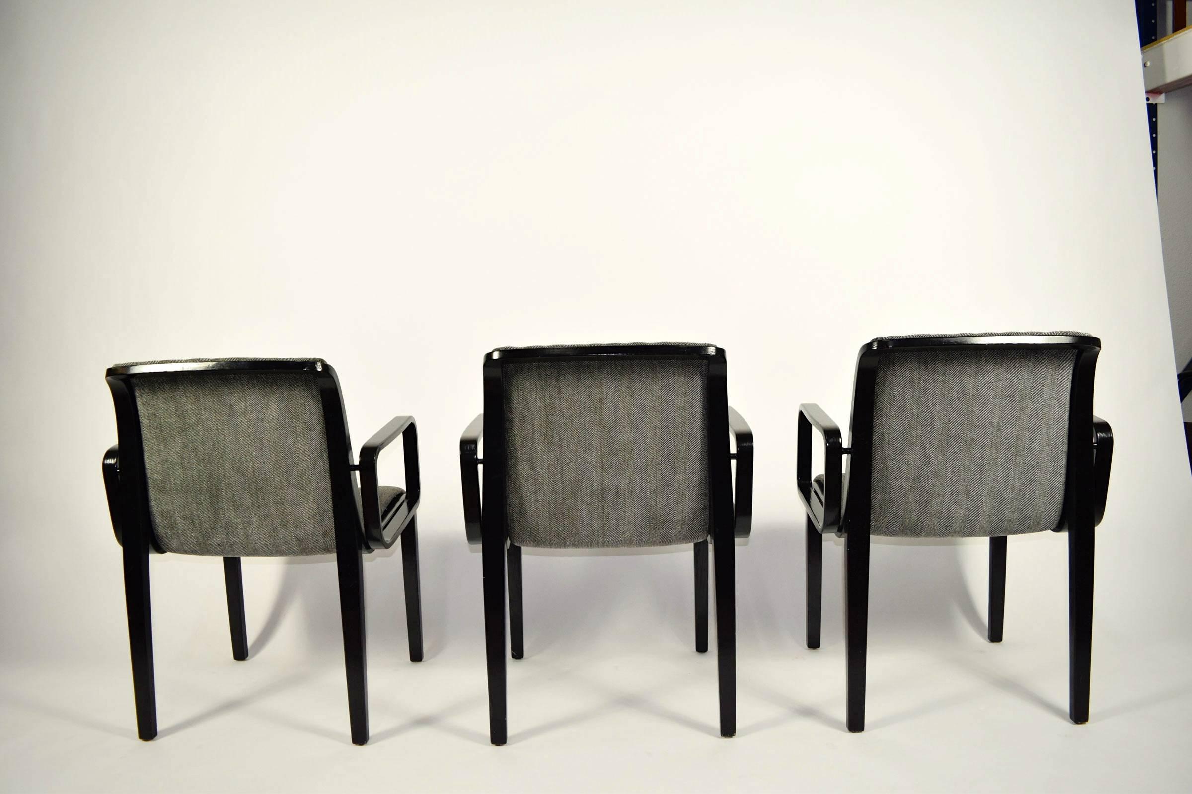 Set of six Bill Stephens for Knoll dining chairs. In black lacquer/paint with a black and white herringbone fabric. All chairs have arms.