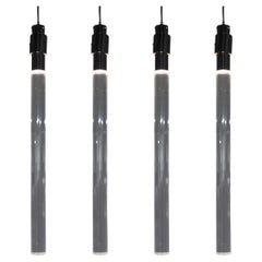 Set di quattro lampade a sospensione in lucite e metallo in stile Angelo Mangiarotti