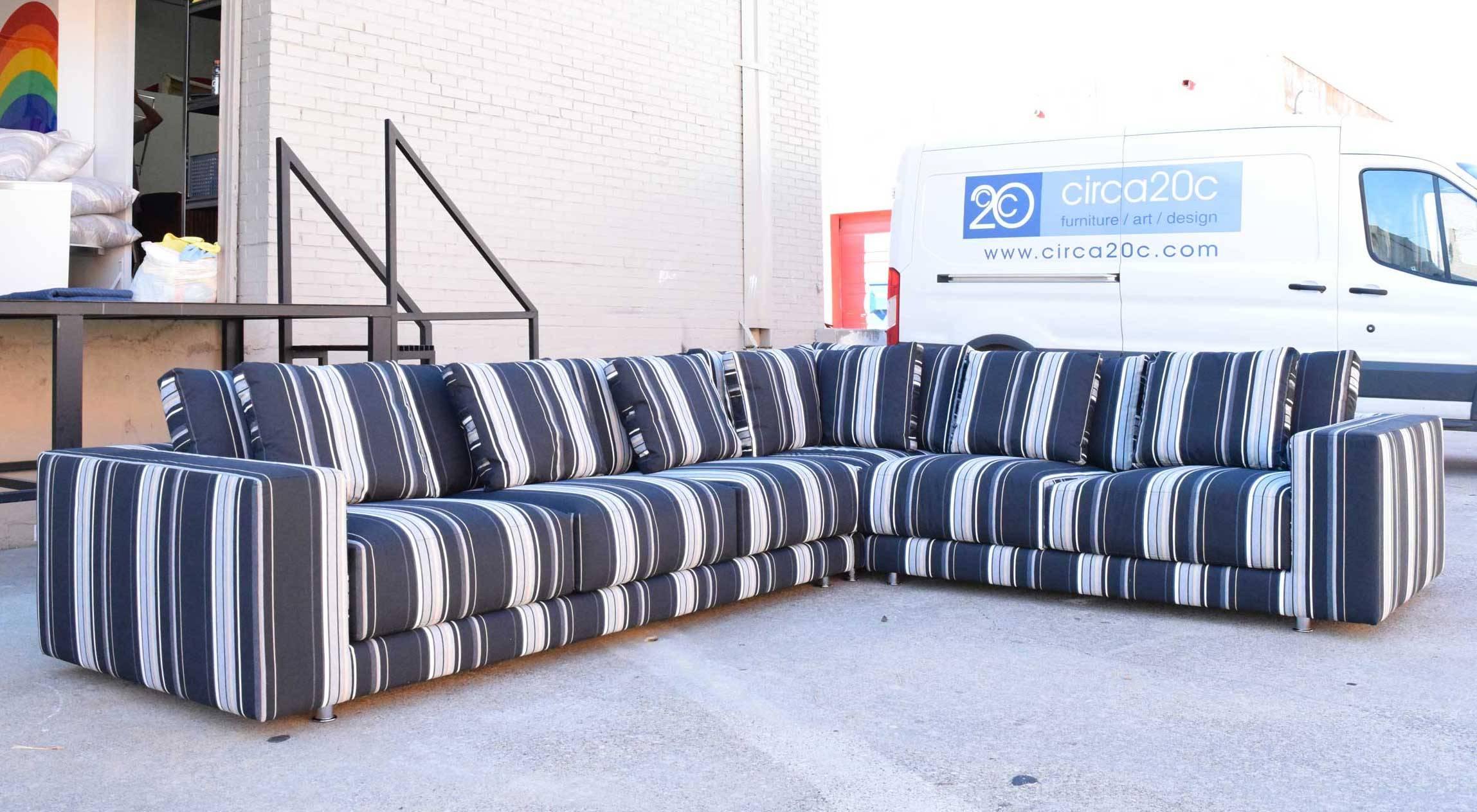 Like brand new, beautiful Della Robbia sectional in black, grey, white strips with touch of yellow. Three pieces include corner piece, three-seat section and a two seat section. Chrome legs that screw in.
