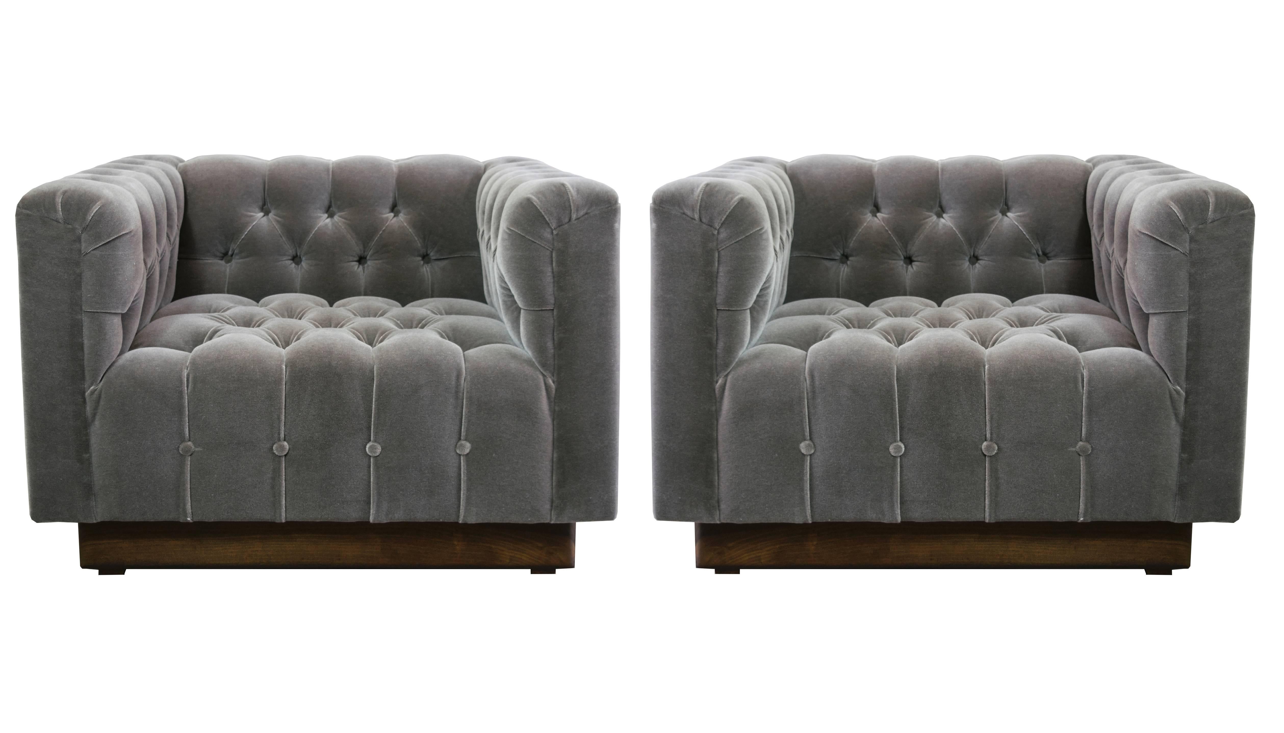 Sumptuous and elegantly tailored oversized lounge chairs by Milo Baughman. Donghia smoky gray mohair and a walnut plinth base. Knock outs!