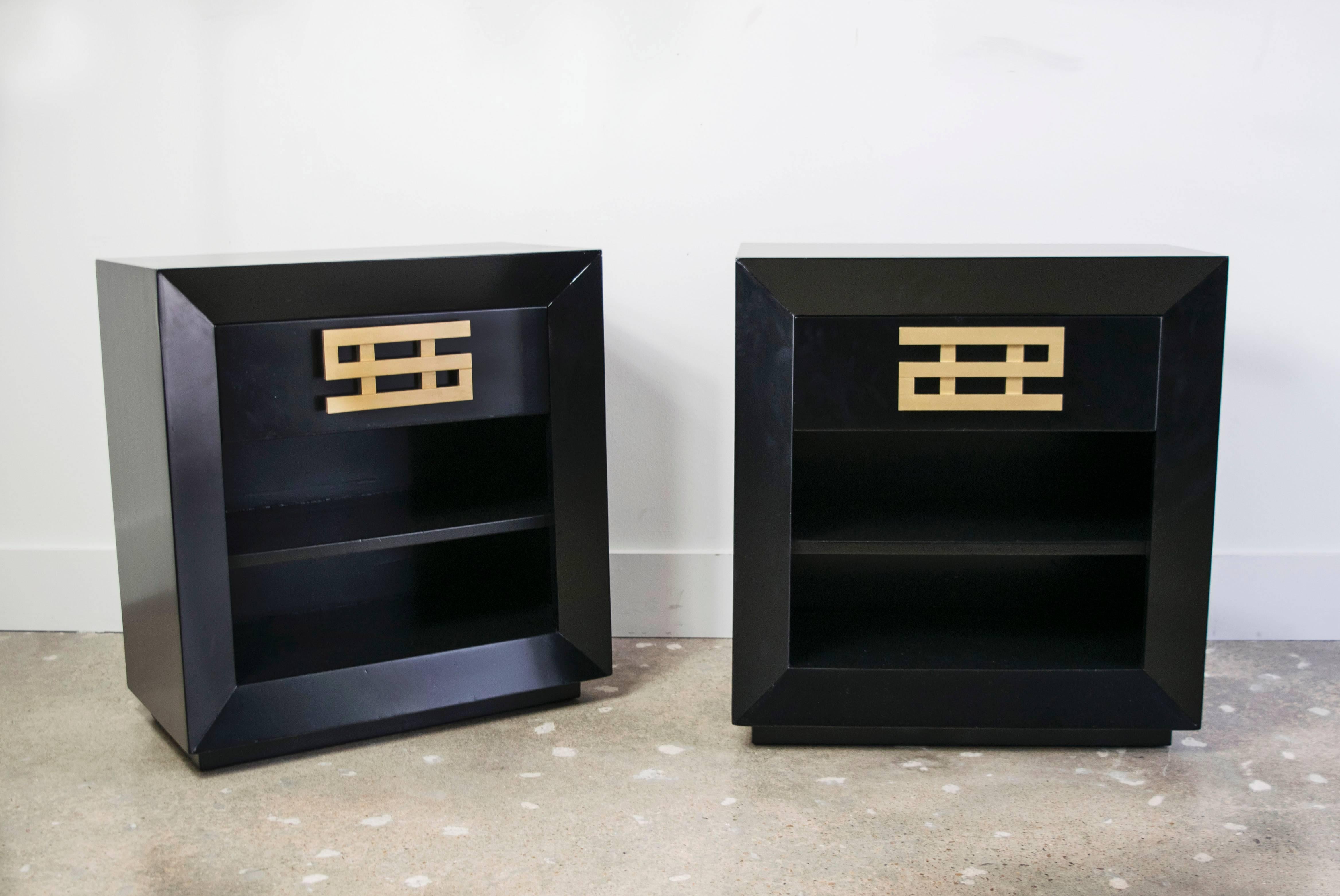 Exceedingly rare ebonized nightstands by Maximilian Karp made in the 1960s in California. The brass hardware pulls were made in the shape of dollar signs after the cartoon character Richie Rich. The nightstands have one drawer and two shelves below.