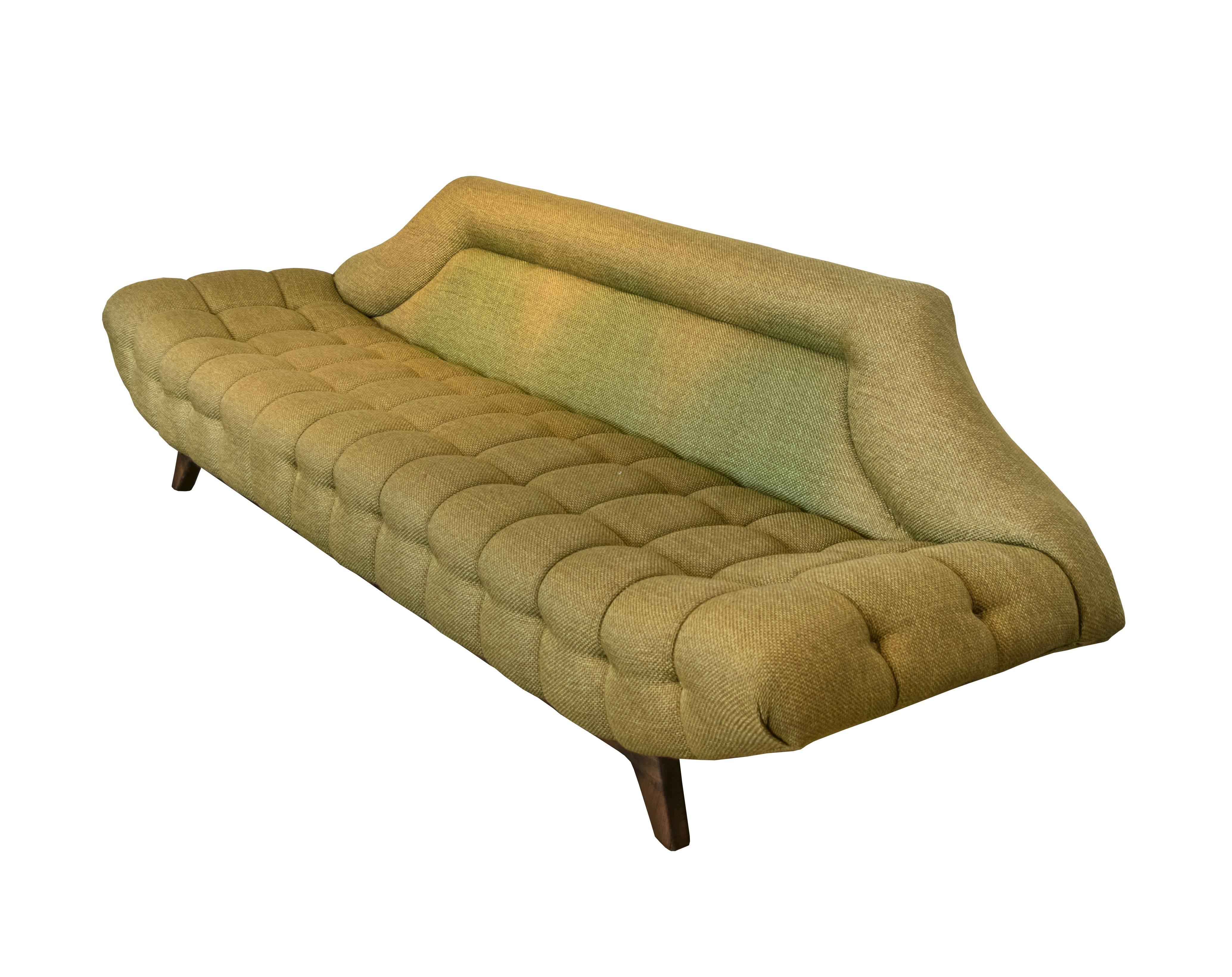 Highly sculptural gondola sofa by Adrian Pearsall in the original fabric that needs reupholstering. Extensive biscuit tufting. We have had several of these sofas before and they look smashing recovered in velvet and/or mohair upholstery.
