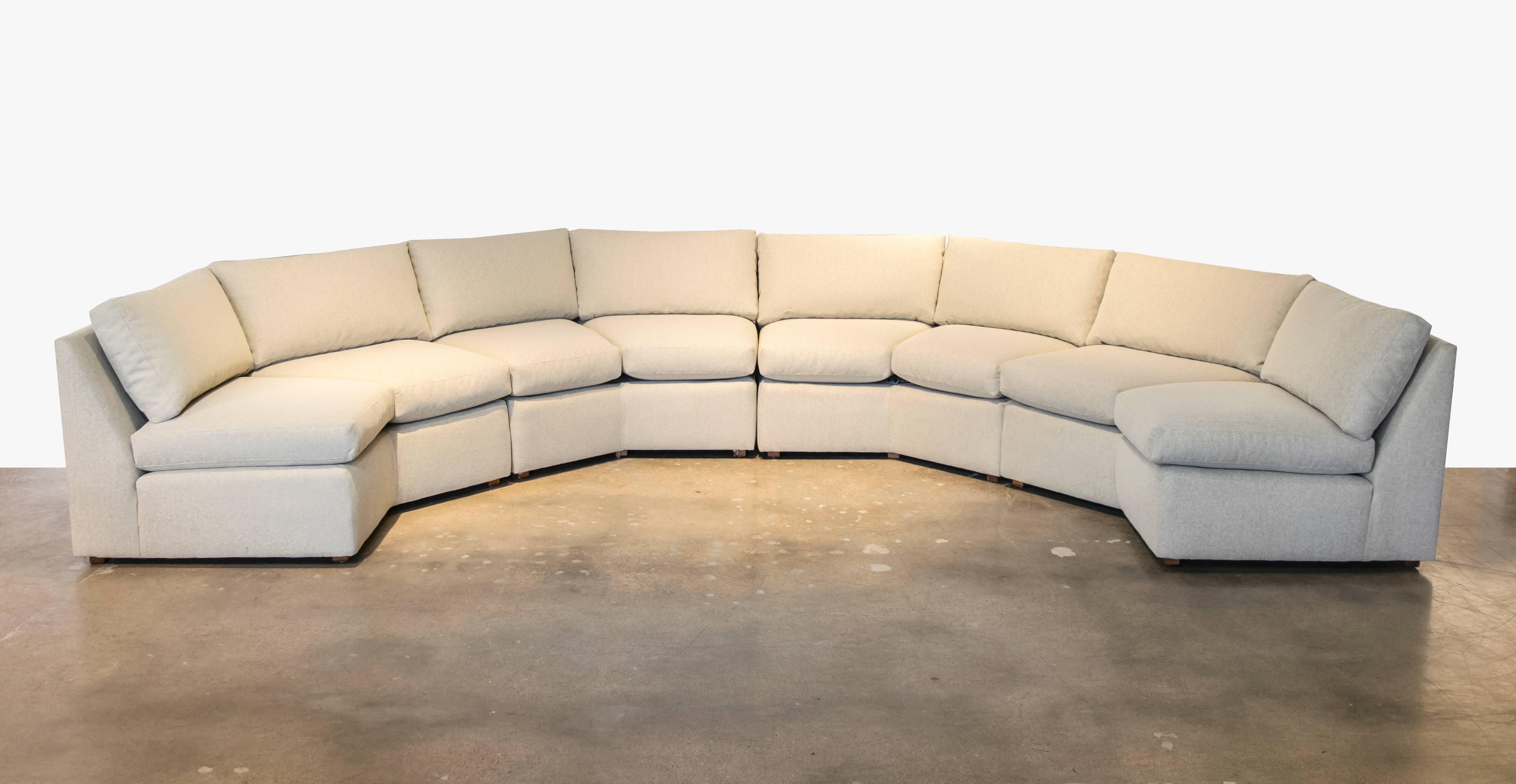 Here's a conversation pit sofa you've been waiting for! Recently recovered in new Maharam creme indoor/outdoor fabric. Can be configured in one continuous serpentine shape, as a semicircle or as two facing sofas.