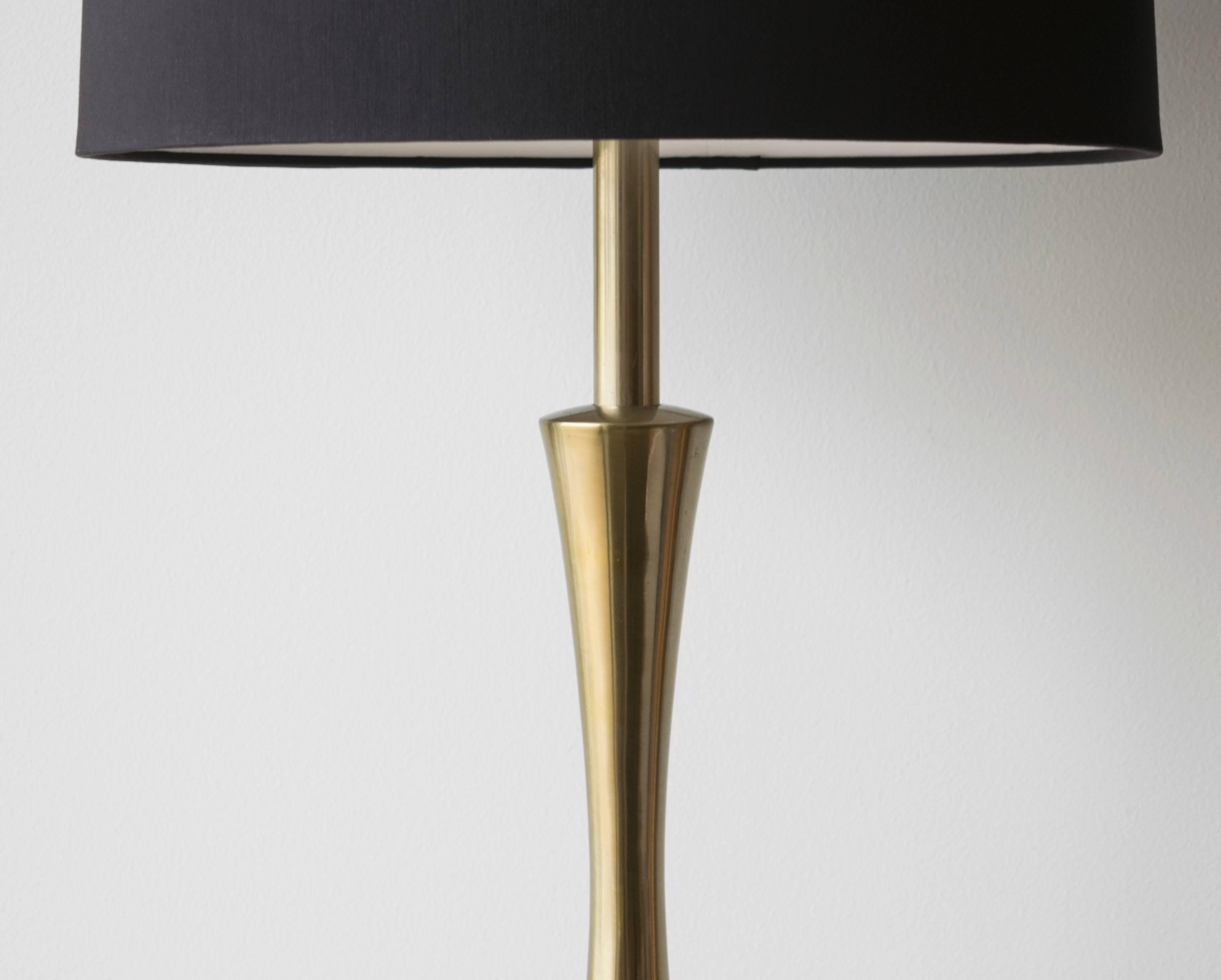 This pair of lamps designed by Maurizio Tempestini is fabulous! The base is octagonal shaped with a contrasting triangle of volcanic and smooth brass which tapers up into a long graceful neck.