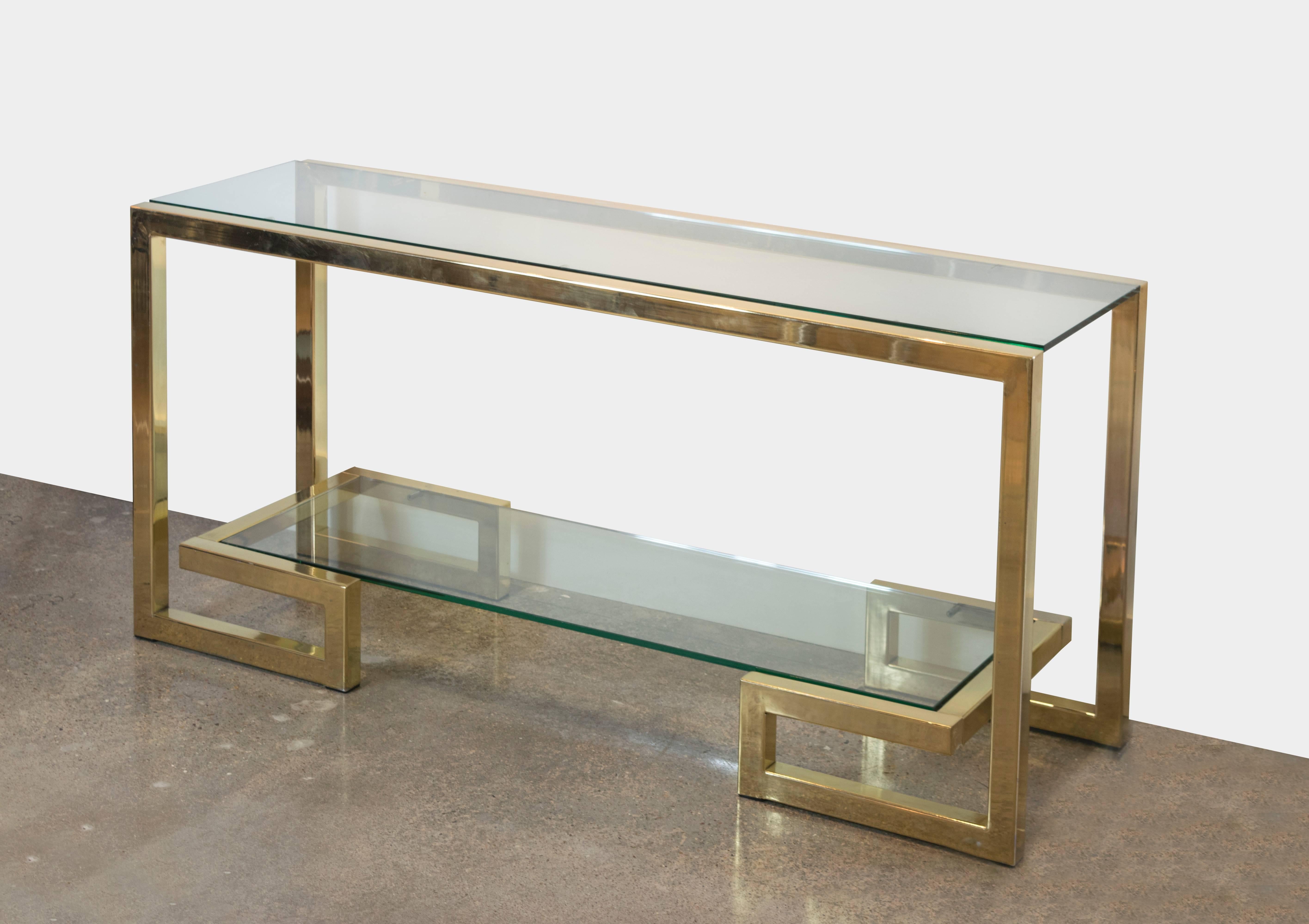 Glamorous yet architecturally straightforward, this console table has two floating shelves, and the bottom shelf sits on a Greek key base. This is a perfect table to go on a hall wall or in front of a sofa as the front facing is flawless.