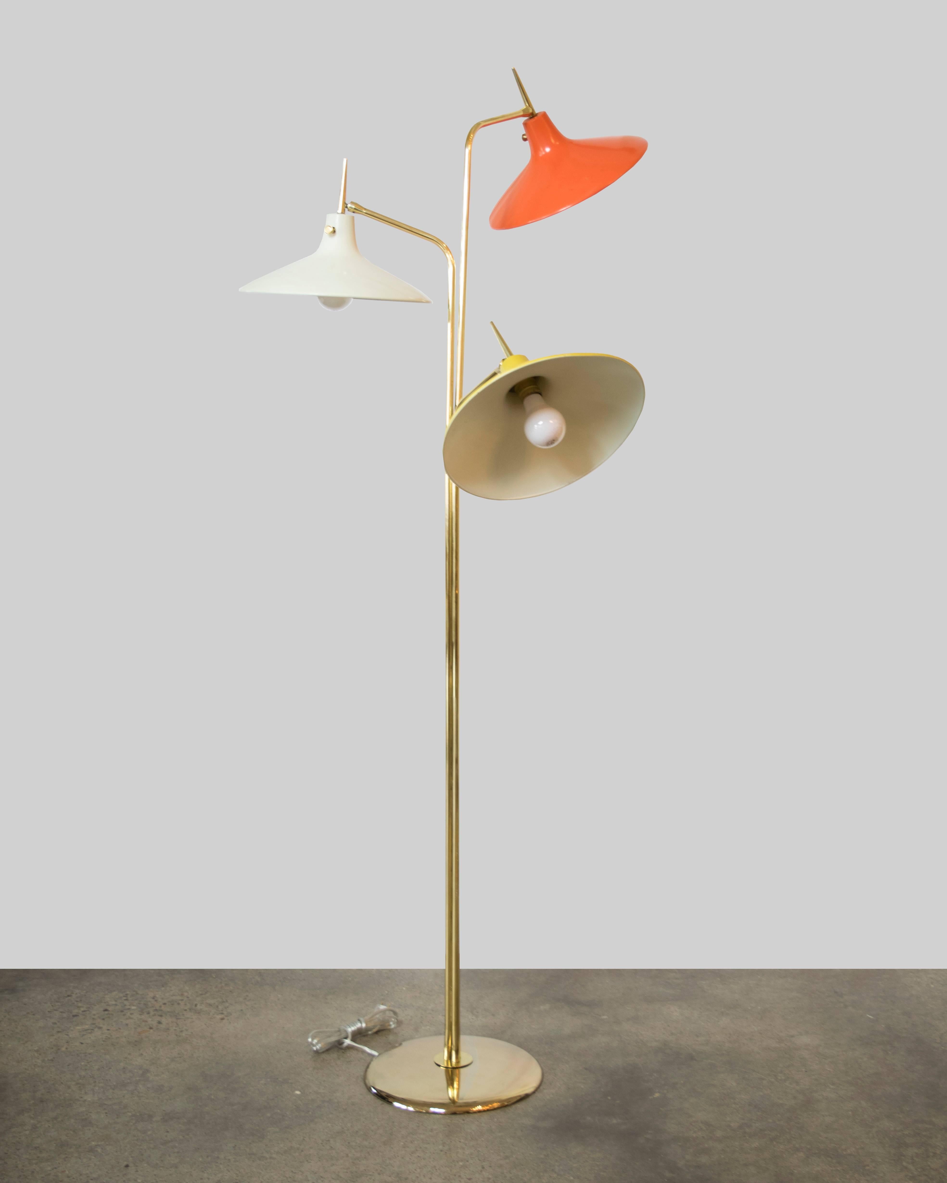 Beautiful three-light saucer shape brass and enamel floor lamp by Gio Ponti with multicolored shades, one orange, one yellow, one off-white.