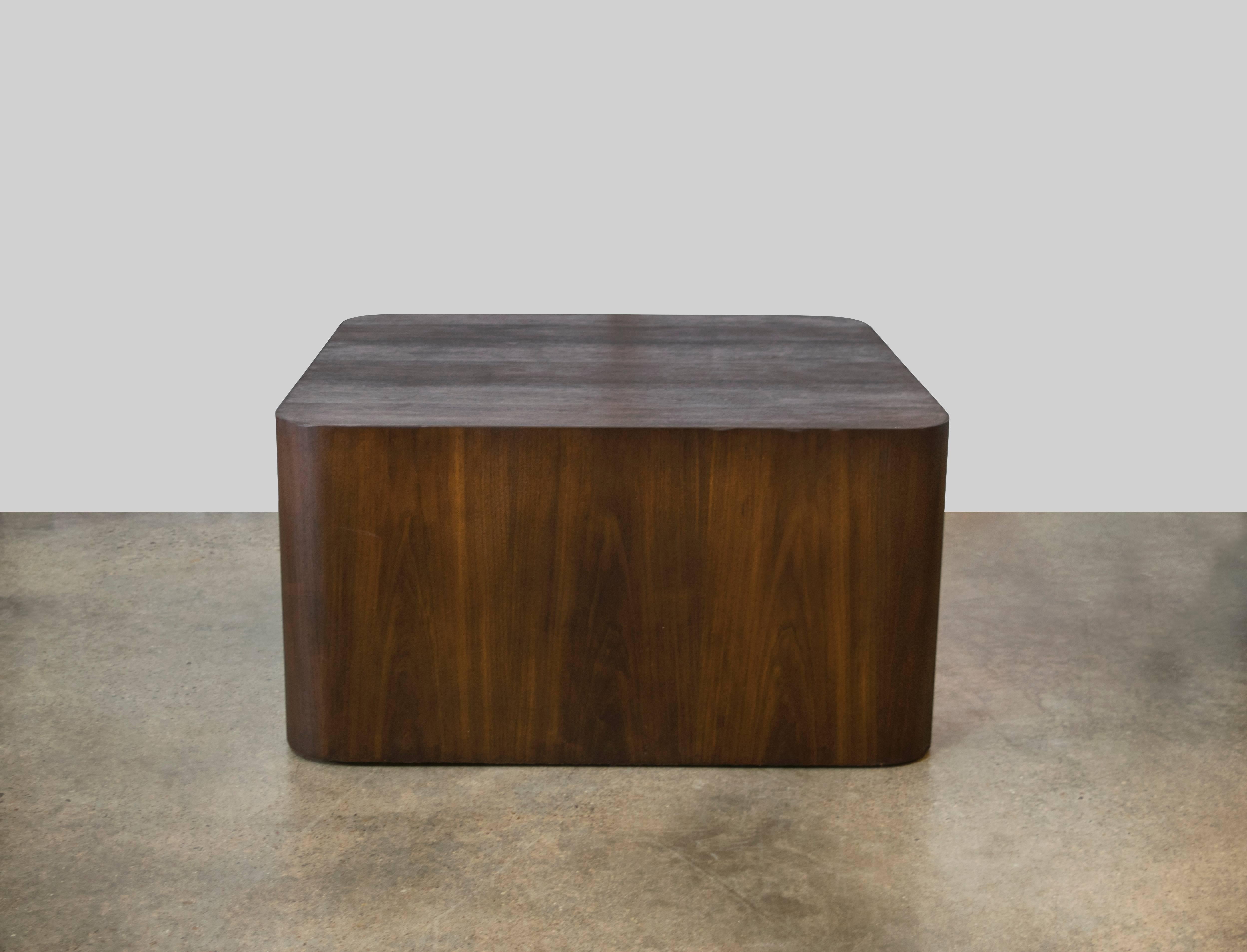 Here is a perfect substantial curved corner cube table by Paul Mayen in walnut with a darker walnut stain. Recently restored.
