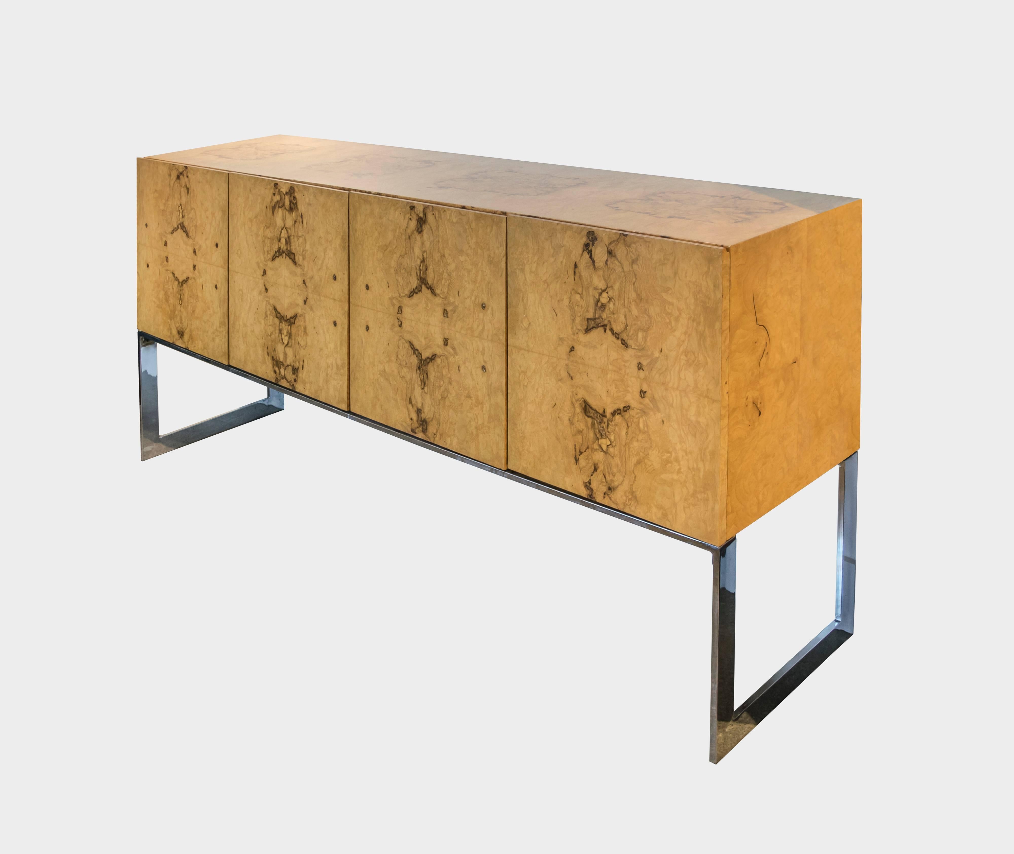 Rarely do we come across an actual Milo Baughman for Thayer Coggin gorgeous buffet or credenza. It features two silver lined drawers for cutlery and utensils on one side and on the other side there are two shelfs, one made of smoked glass and the