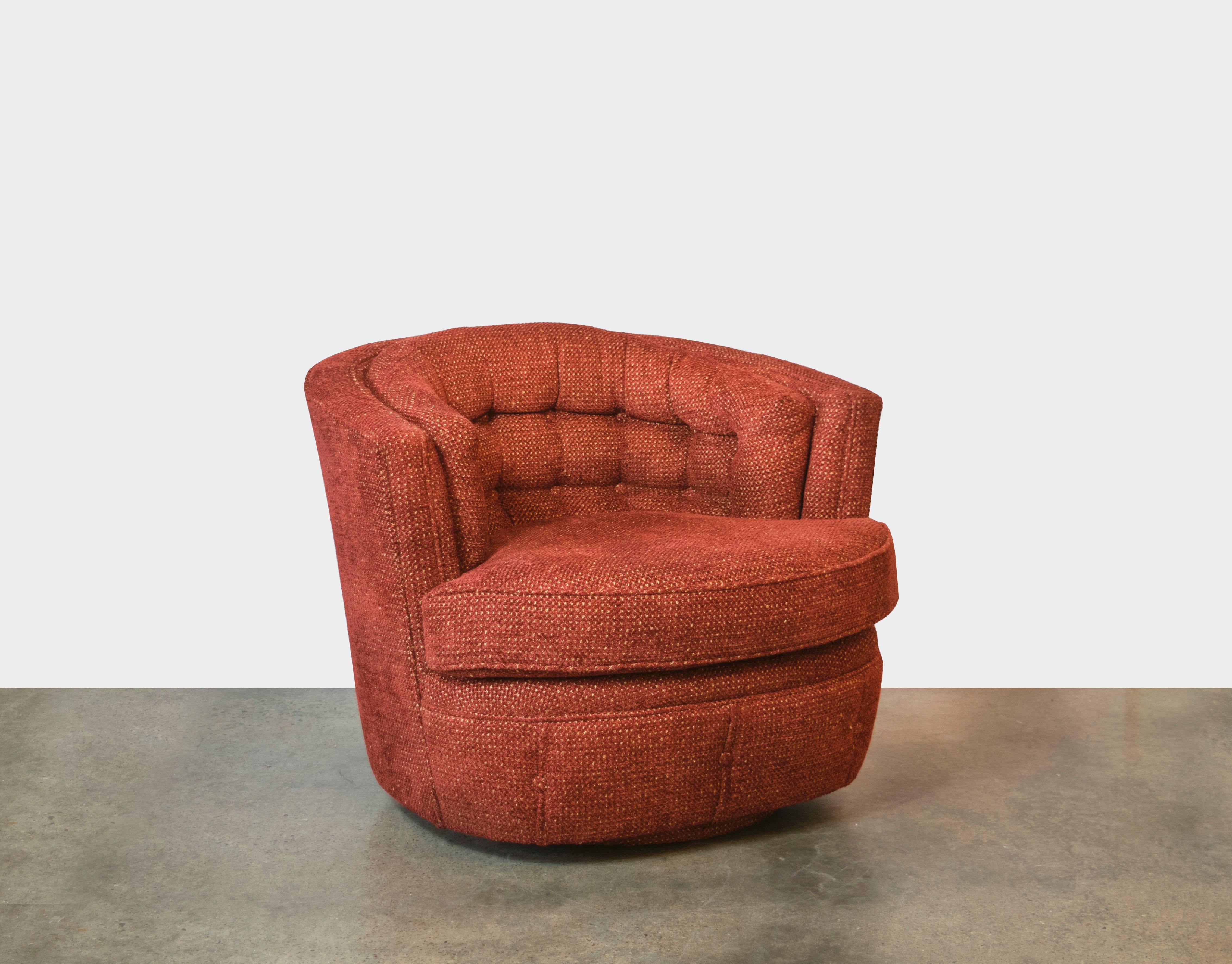Everybody loves swivel chairs, especially those designed by Milo Baughman. This pair has been recently reupholstered in Knoll Textiles Coco Chenille, color way brick. Excellent back cushion tufting makes these chairs extremely comfortable - would be
