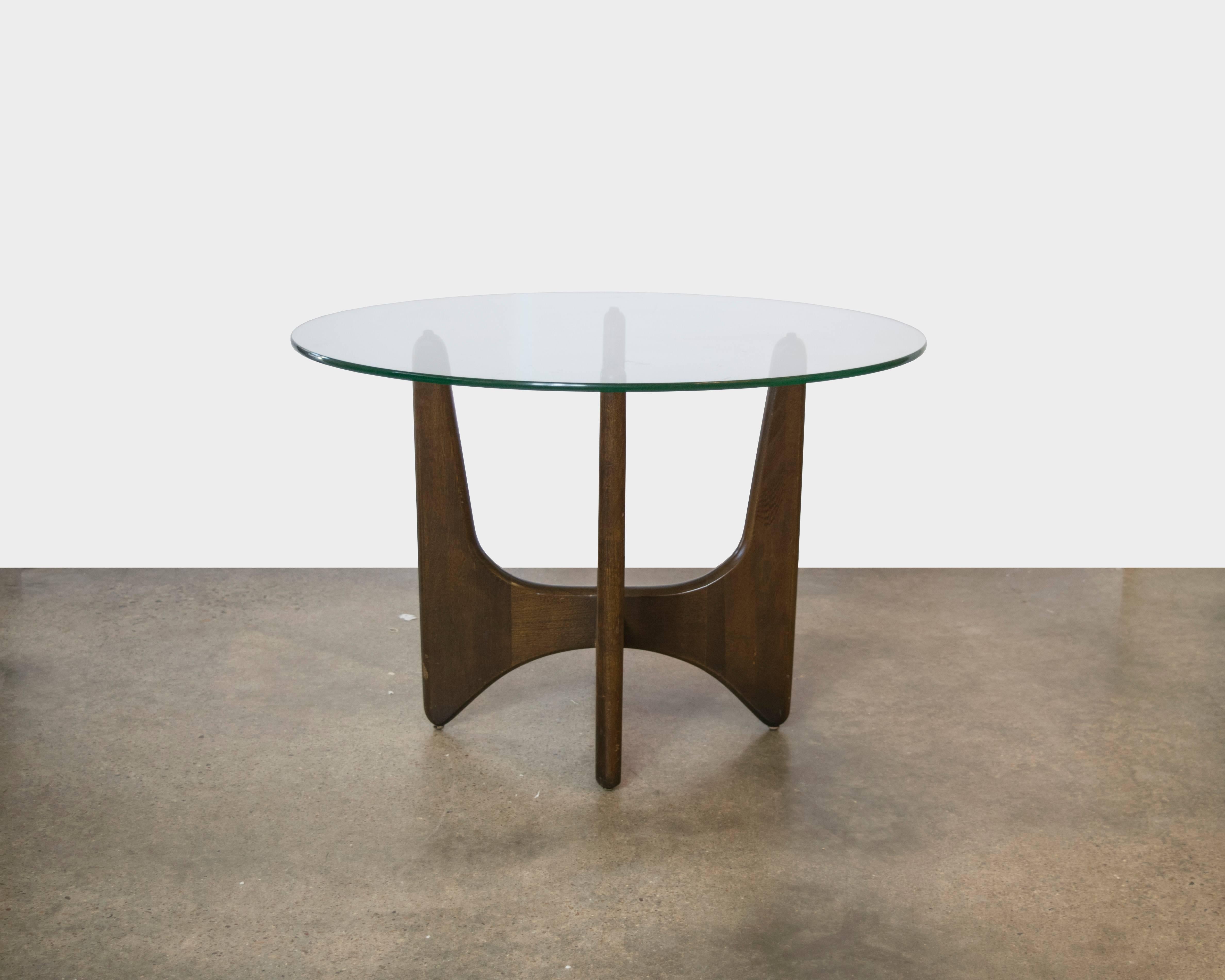 These tables are ironically Adrian Pearsall with the criss crossed x bases and round glass tops.
