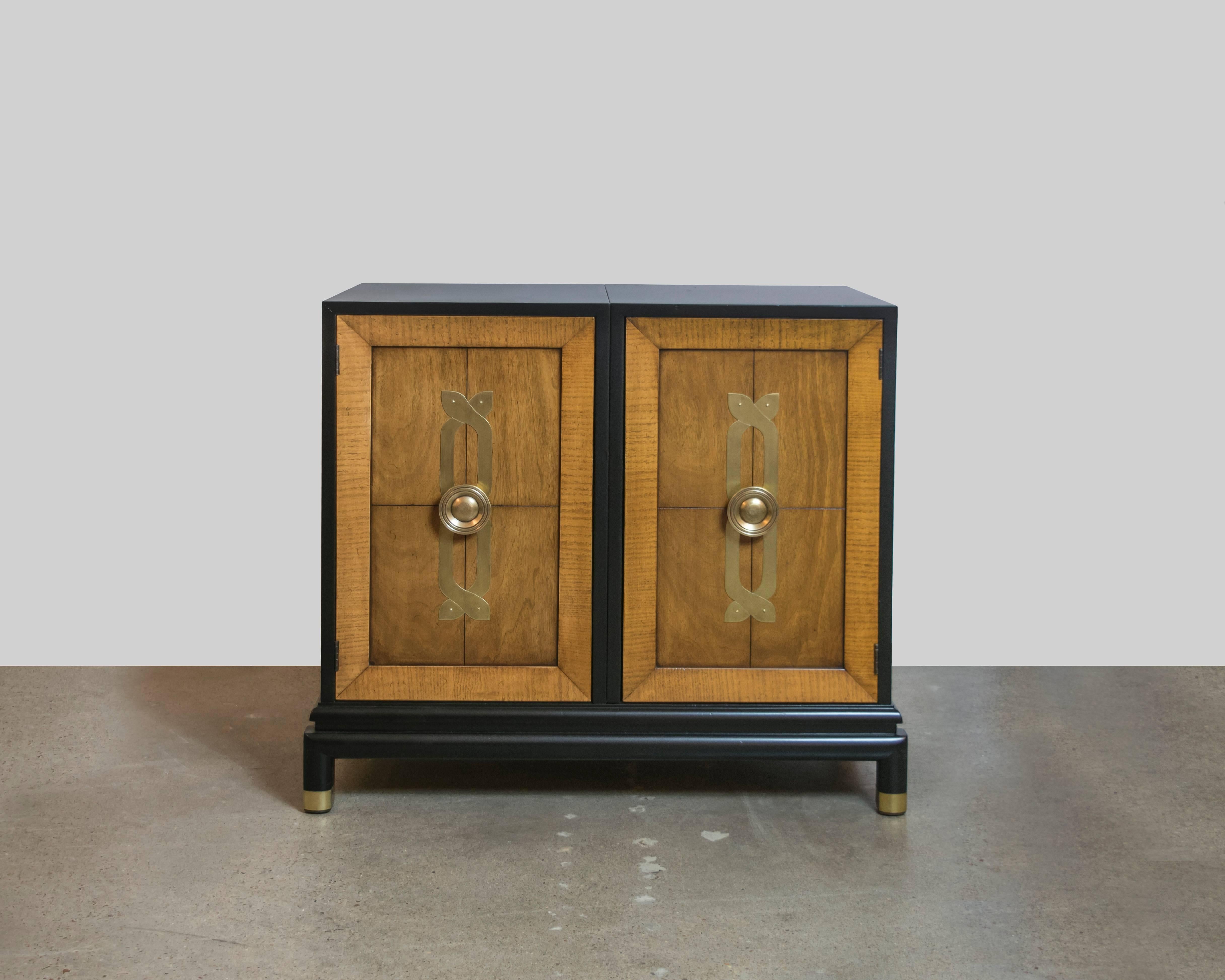 Here's a knockout pair of Renzo Rutili chests for Johnson Furniture manufactured in the 1960s. These oversized commodes are made of a combination of materials beginning with the outer cabinet which is ebonized lacquer over mahogany. The cabinet
