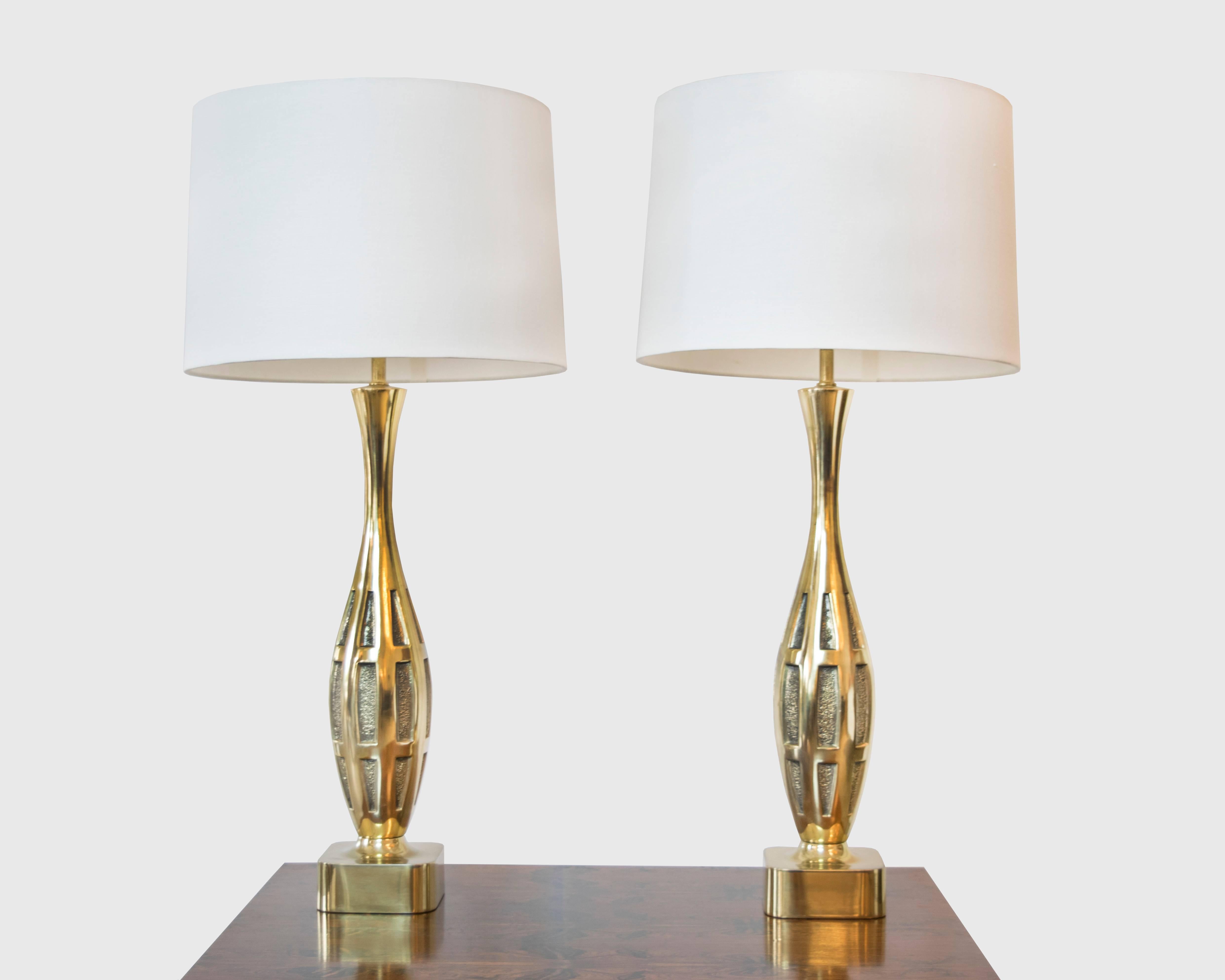 This is a graceful pair of brass two toned lamps by Tony Paul for Westwood with an elegant bowling pin base. We've never seen another pair like it.