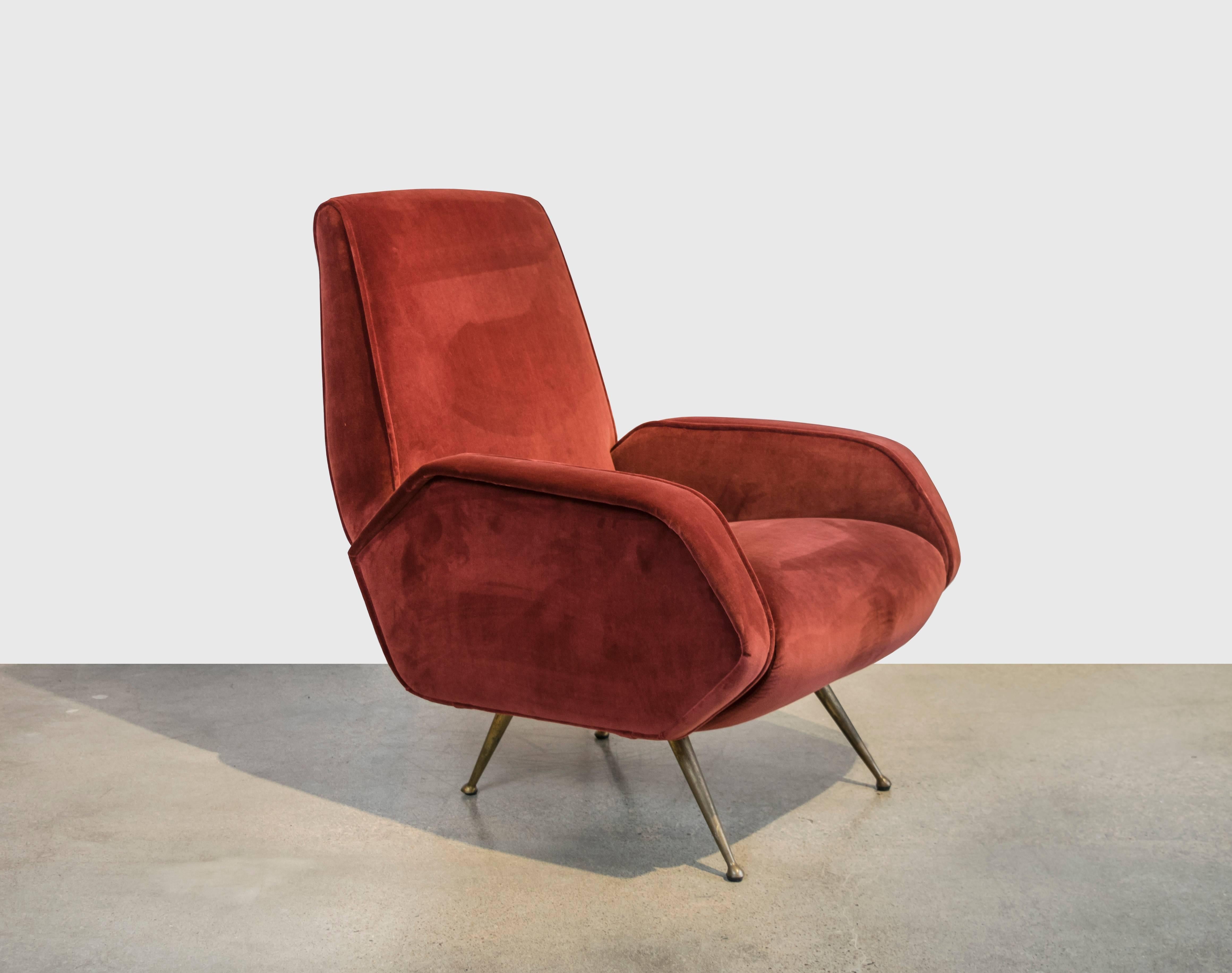 A gorgeous single Mid-Century Italian lounge chair with stiletto brass legs, with exquisite detailing and profile recently upholstered in luscious Holly Hunt velvet.