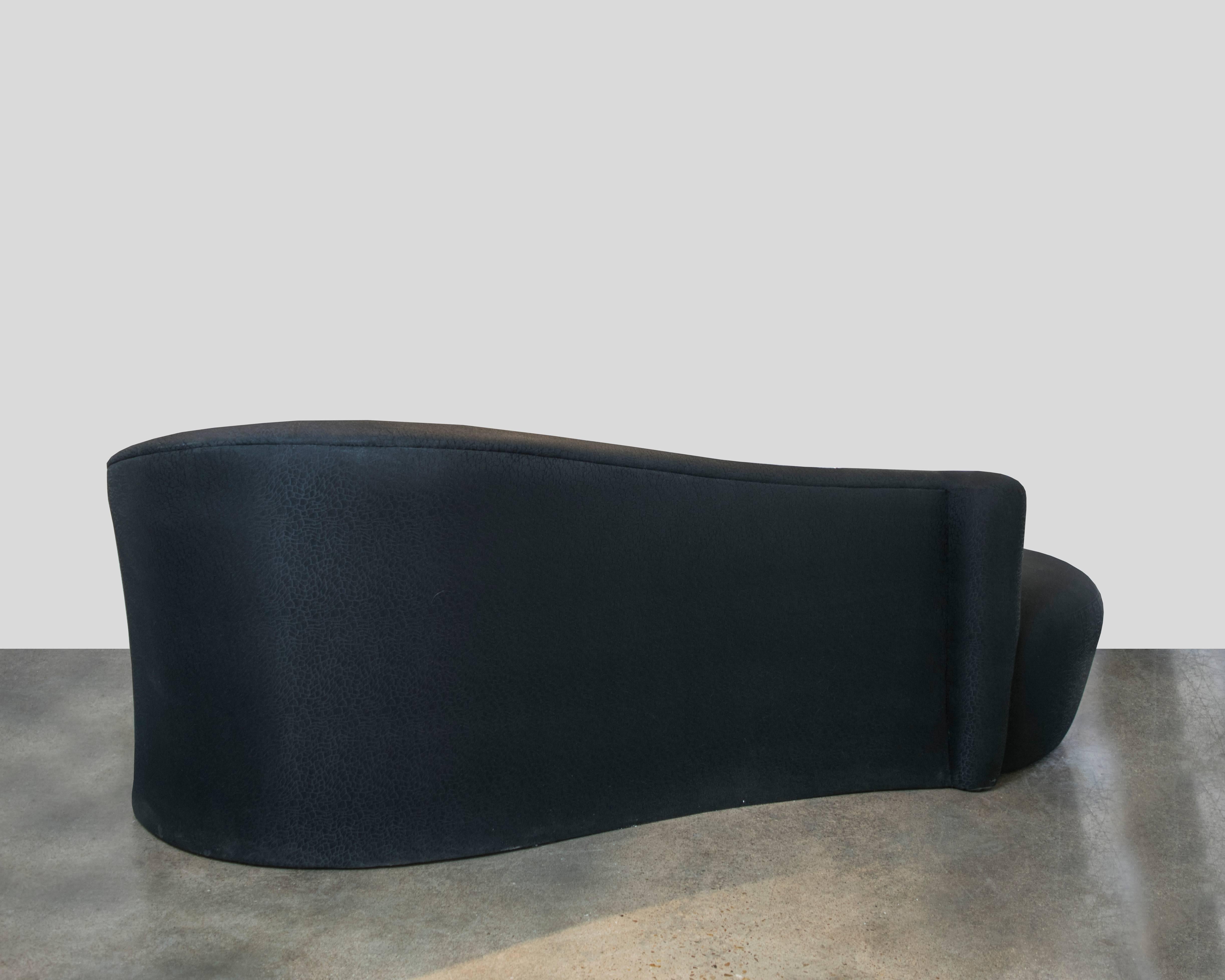 American Sensuous Black Serpentine Sofa with Lucite Leg in the Style of Vladimir Kagan For Sale