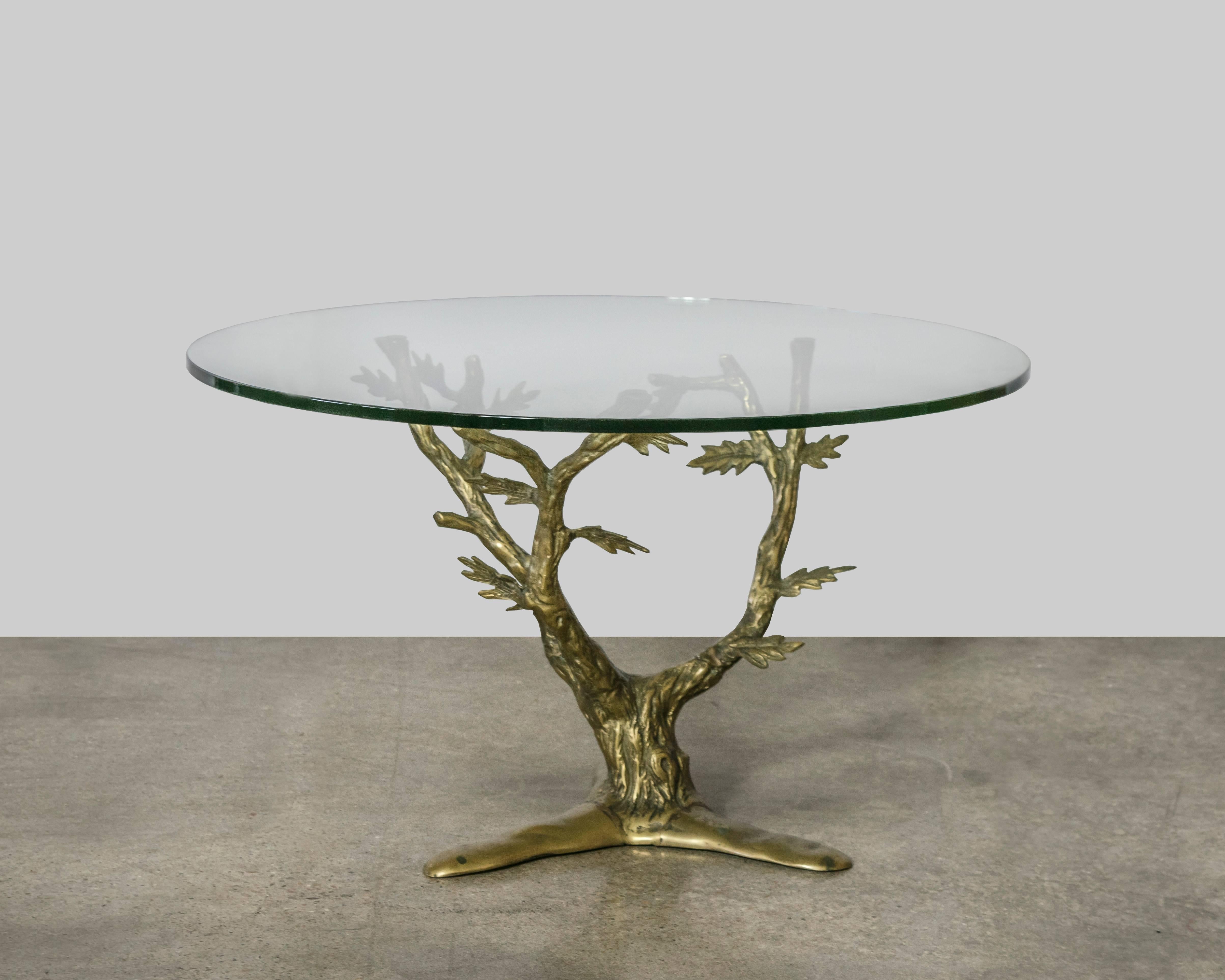 Exquisitely detailed brass tree table with three branch arms and three legs designed and manufactured by Willy Daro. This table is a showstopper.