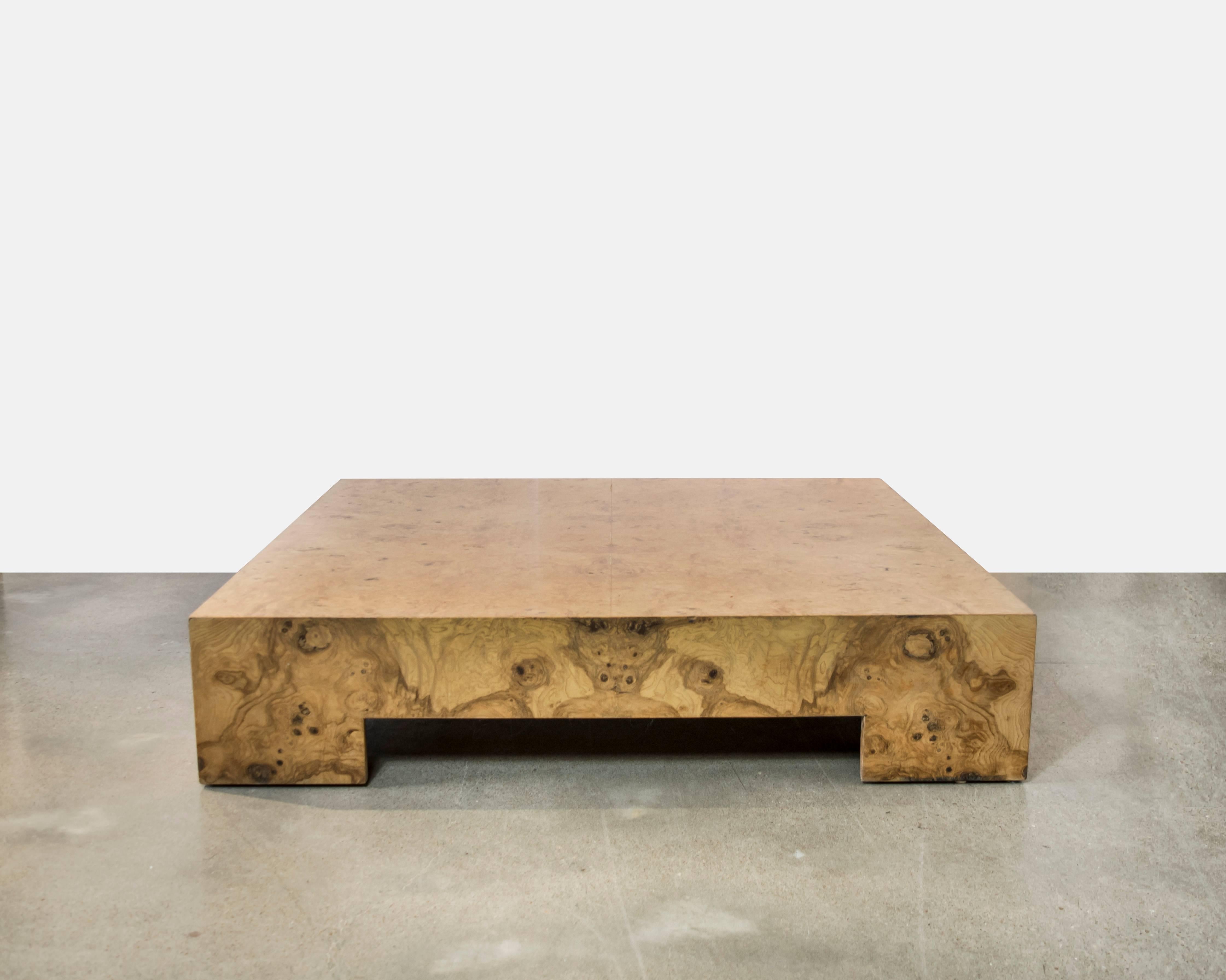 This is a beautiful burl wood Milo Baughman coffee table that sits low. Beautiful natural burl wood detailing. Table is solid and blocky.