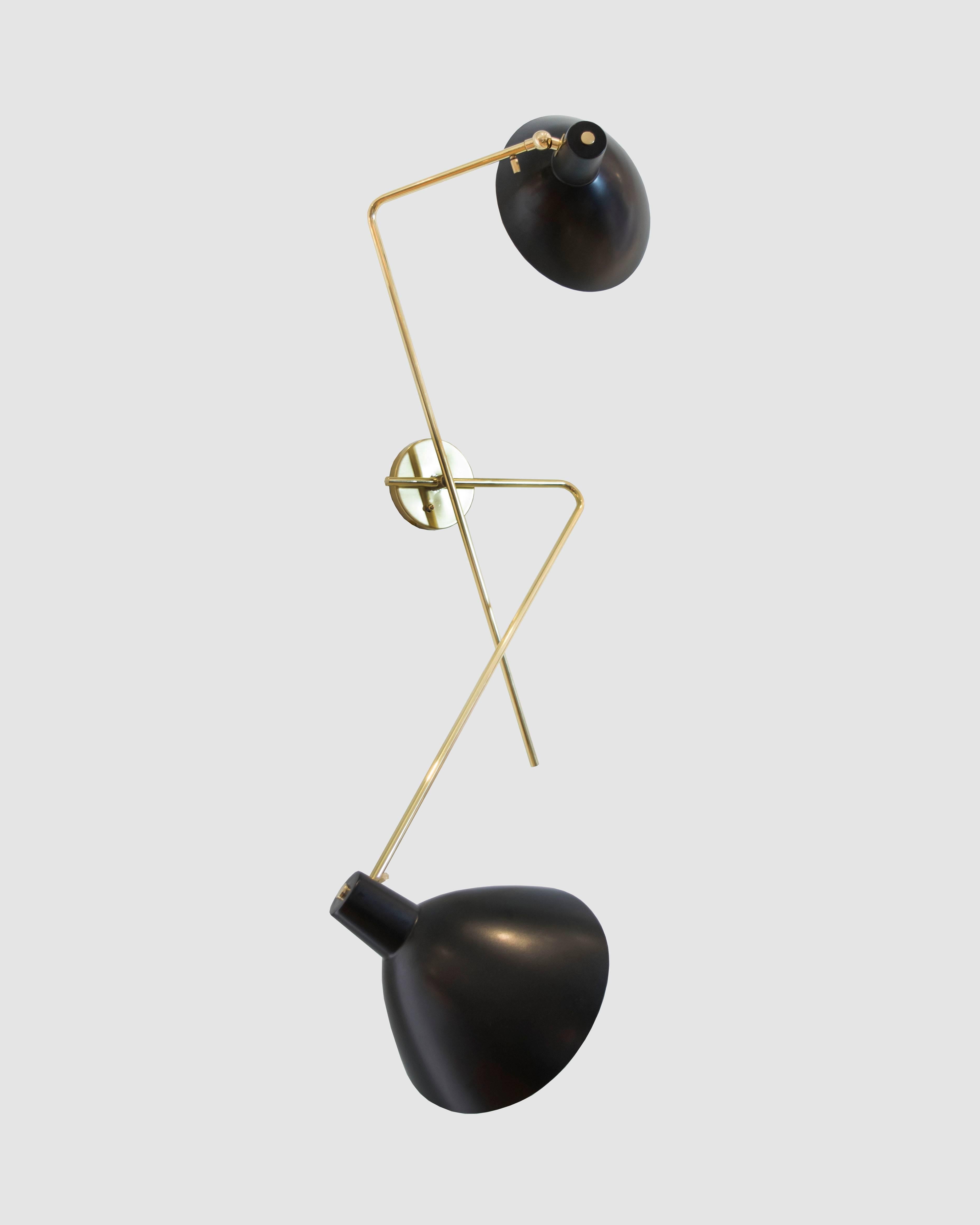 This is an absolutely breathtaking and rare design by Vittoriano Vigano in pure brass and black powder coated metal. An oversized wall light with adjustable sconces for reading lights or reflection.