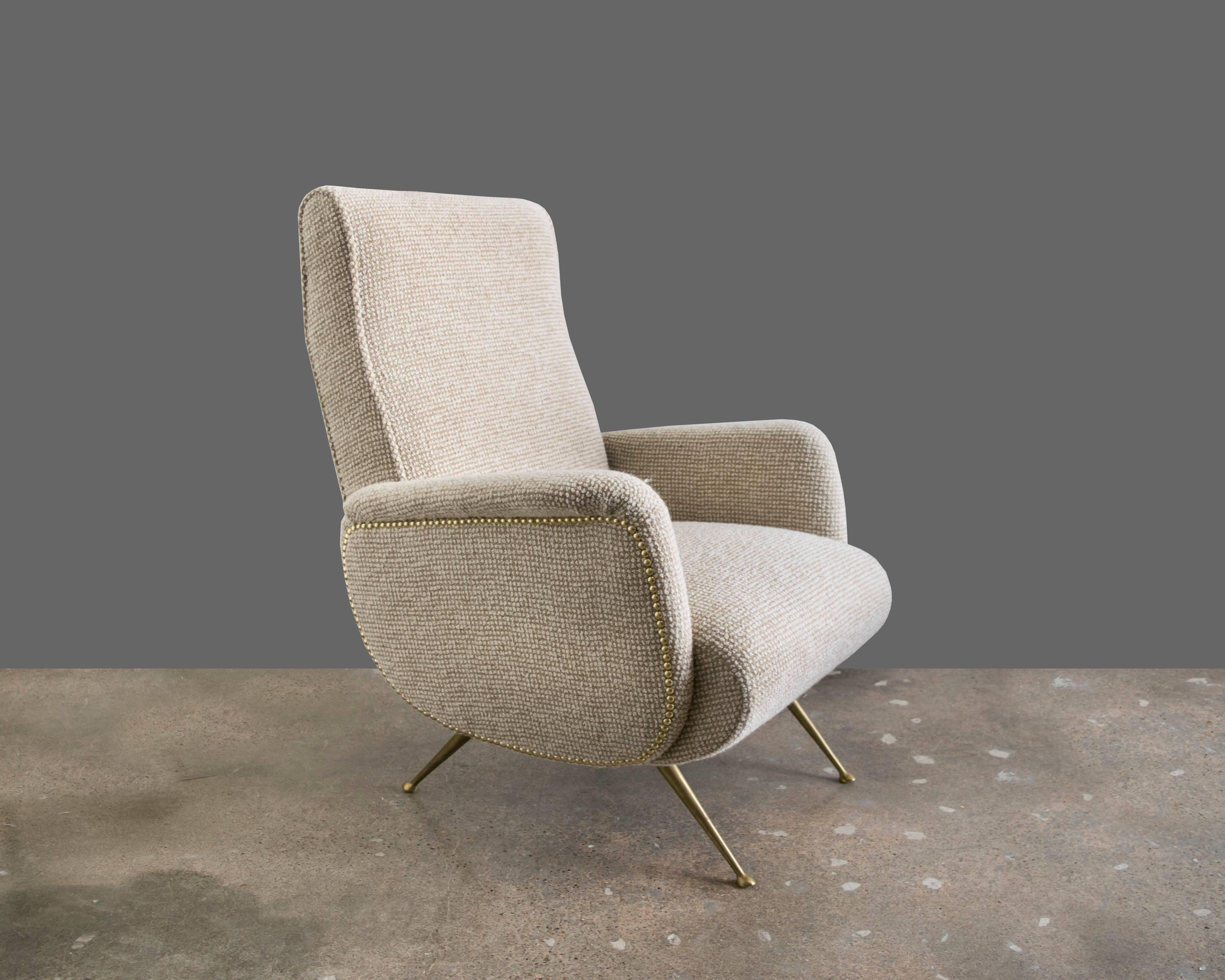 Gorgeous sculptural Italian armchair made by Arflex in the 1950s and thought to be designed by Marco Zanuso. Recently upholstered in Maharam pebble wool and accented with brass studs.