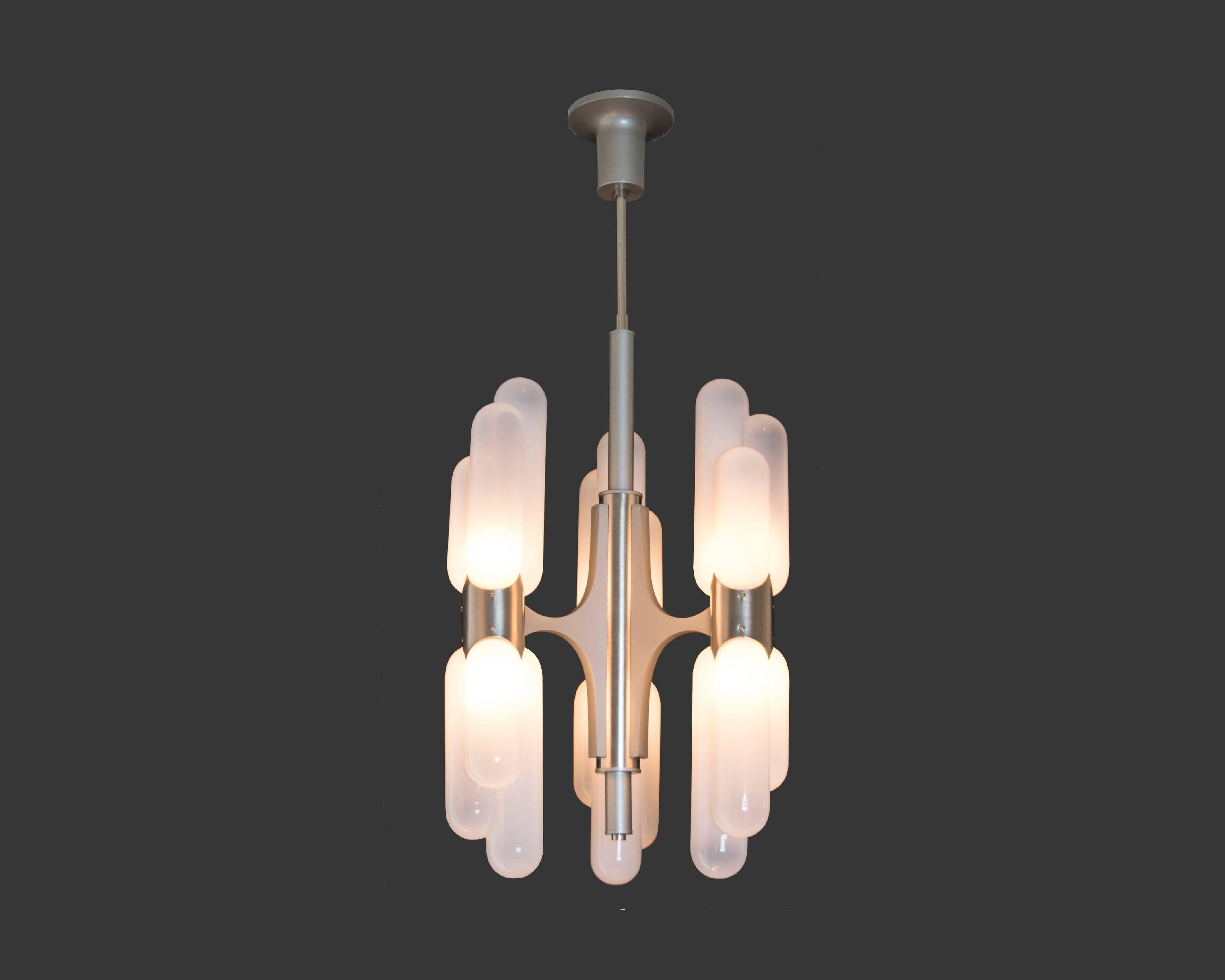 Exquisite handblown Murano glass chandelier by Italian Mid-Century master Carlo Nason for Mazzega lighting. Six torpedo shaped lights up and down; it has recently been rewired to US standards. We have three pairs of sconces and a larger coordinating