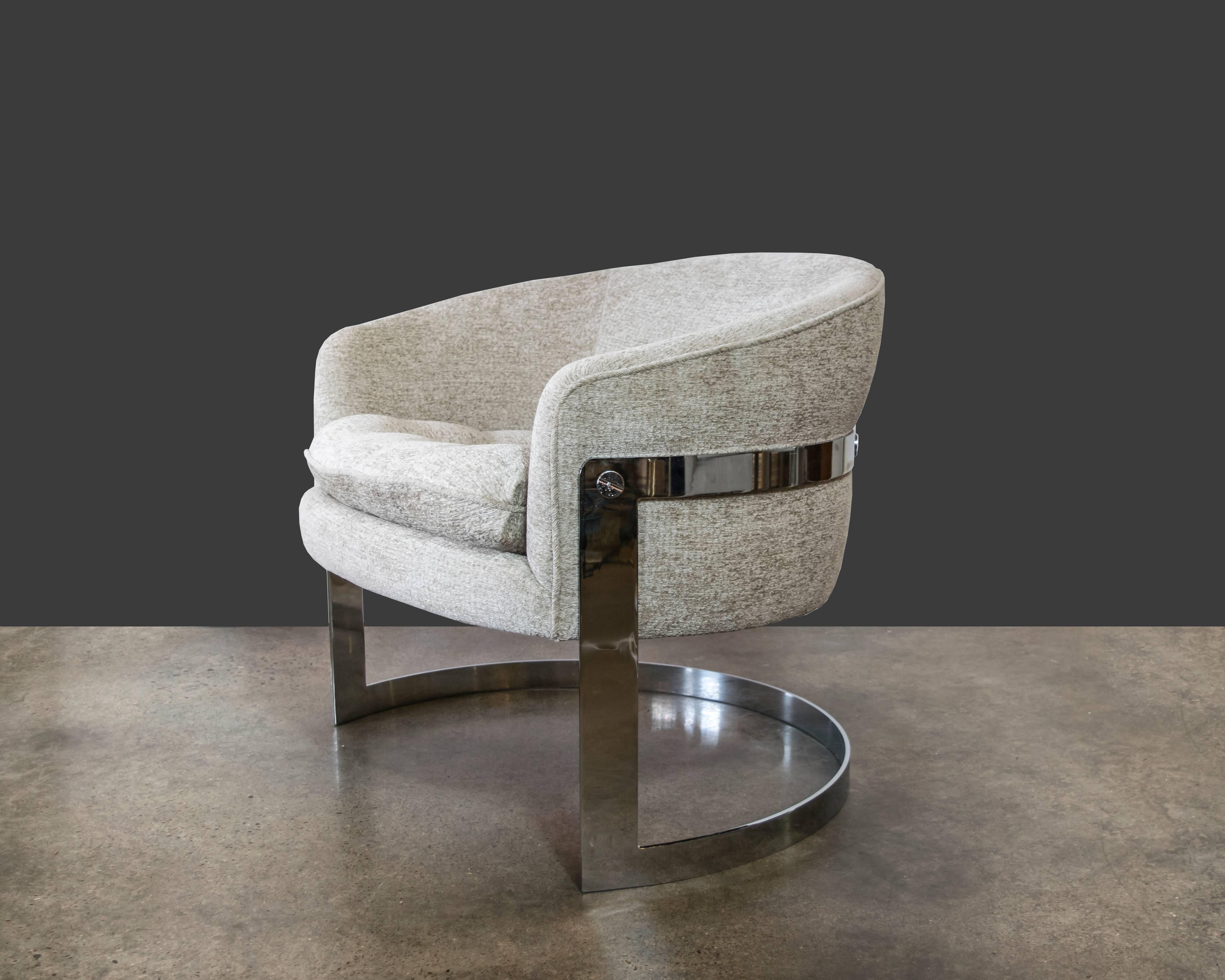 Chrome cantilevered club chair by Milo Baughman for Flair with oversized grommets and a biscuit tufted seat cushion. Excellently upholstered in a beautiful ivory chenille.