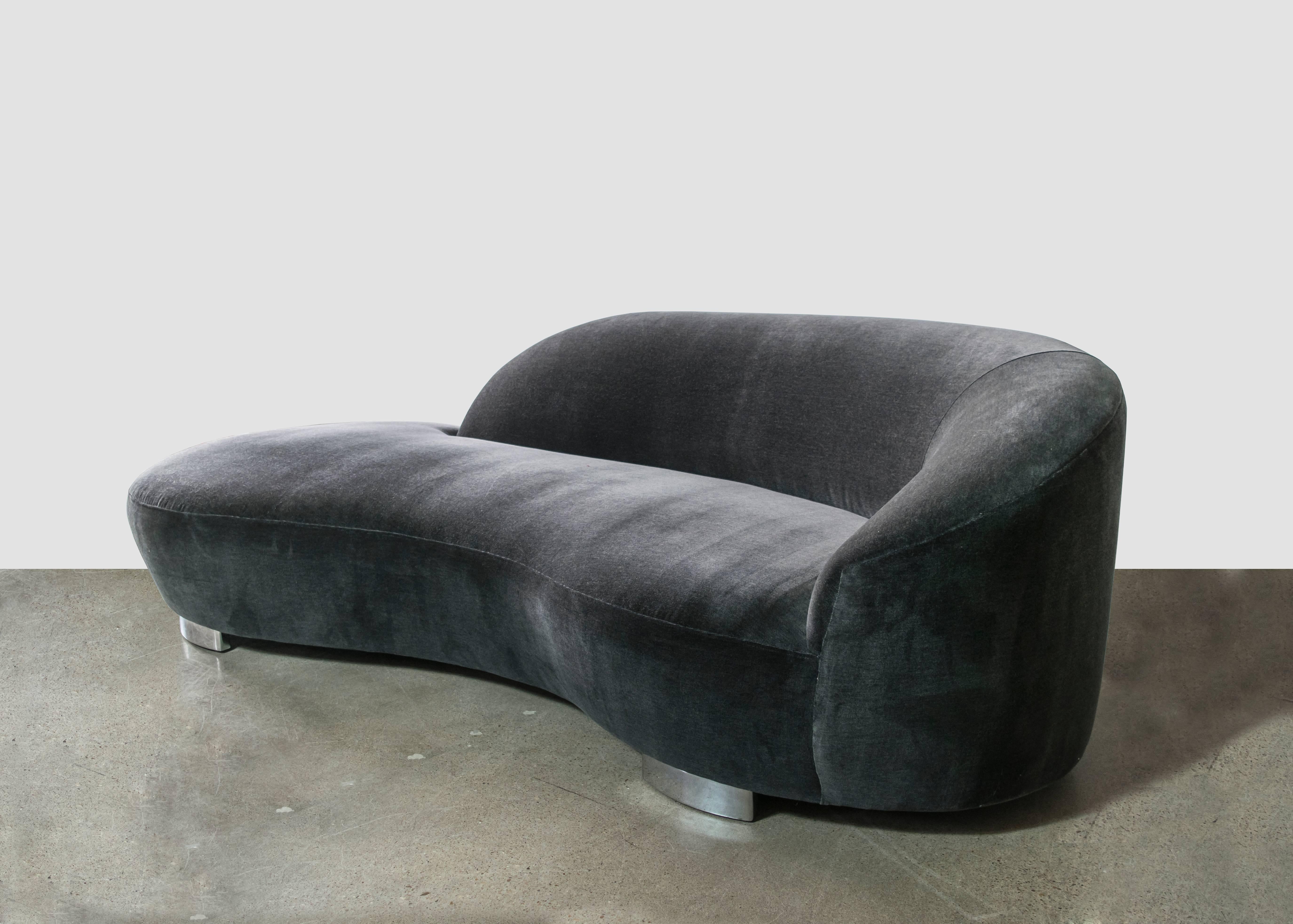 This exquisite cloud sofa designed in the style of Vladimir Kagan by Weiman in the 1990s has recently been upholstered in luxurious charcoal mohair velvet. The sofa sits upon chrome feet.