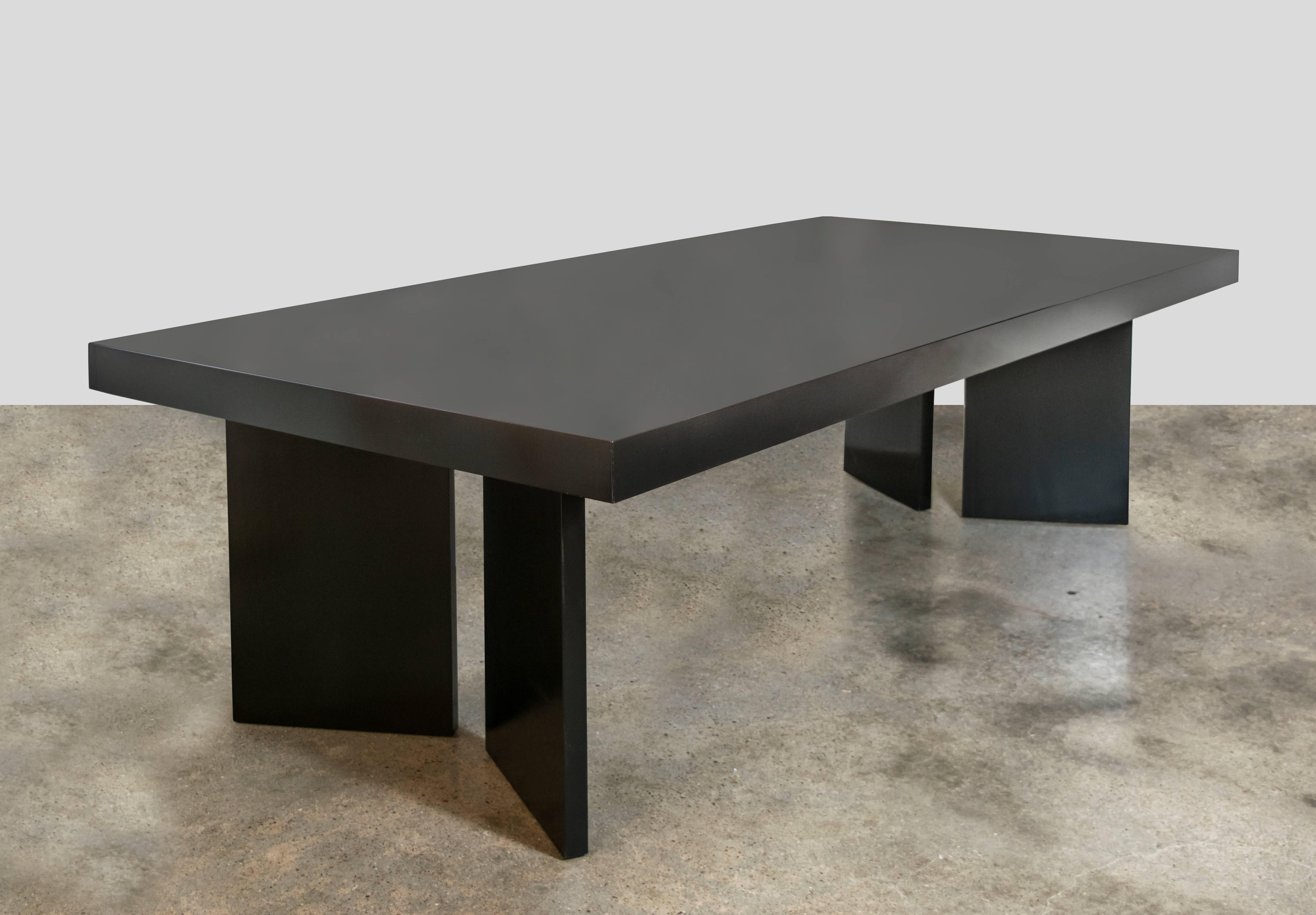 Gorgeous custom mahogany dining table from the 1950s. Ebonized lacquered finish with V-shaped pedestal leg supports. One solid 8 foot long piece, very well constructed. Lacquer finish is glass-like and exquisite.