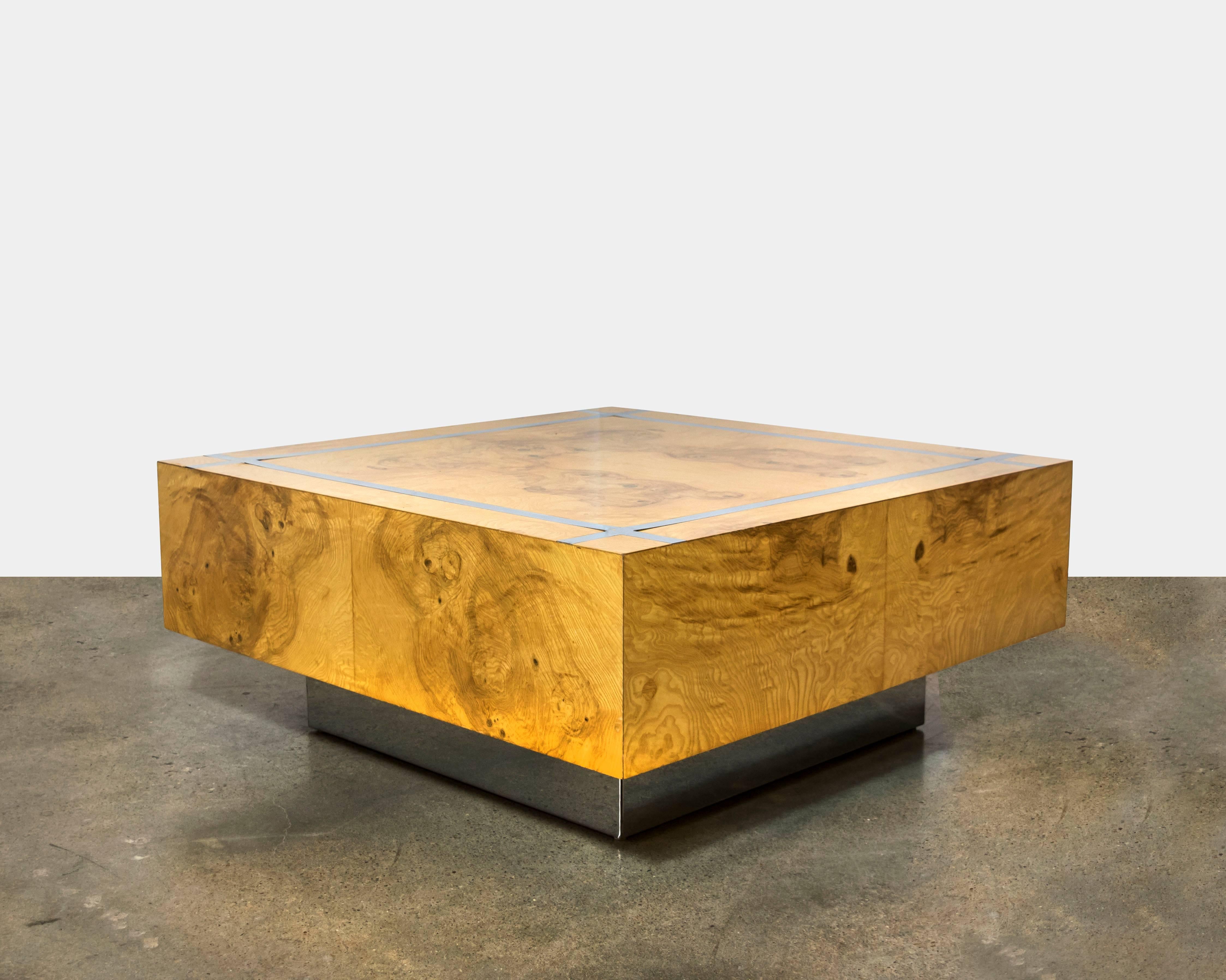 A beautiful cubed book matched burl wood coffee table with incredible graining and crisscross chrome detailing on the surface of the table as well as sitting on a polished chrome base. Solid and substantial.